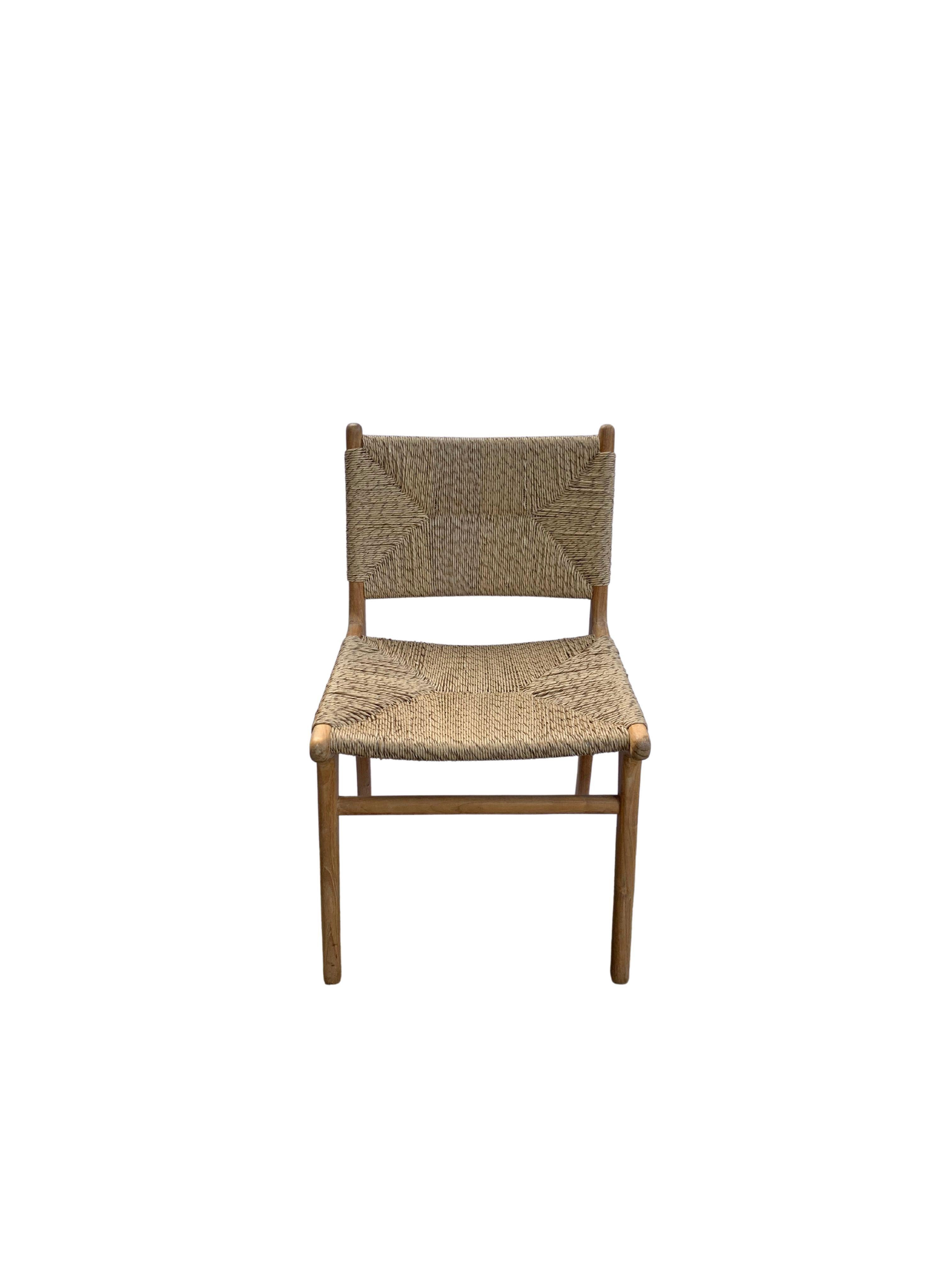 A hand-crafted teak framed & woven synthetic rattan chair. These chairs are crafted by local artisans using a wood joinery technique without the use of nails. They feature a subtle wood texture and are robust and sturdy. Synthetic rattan is more low