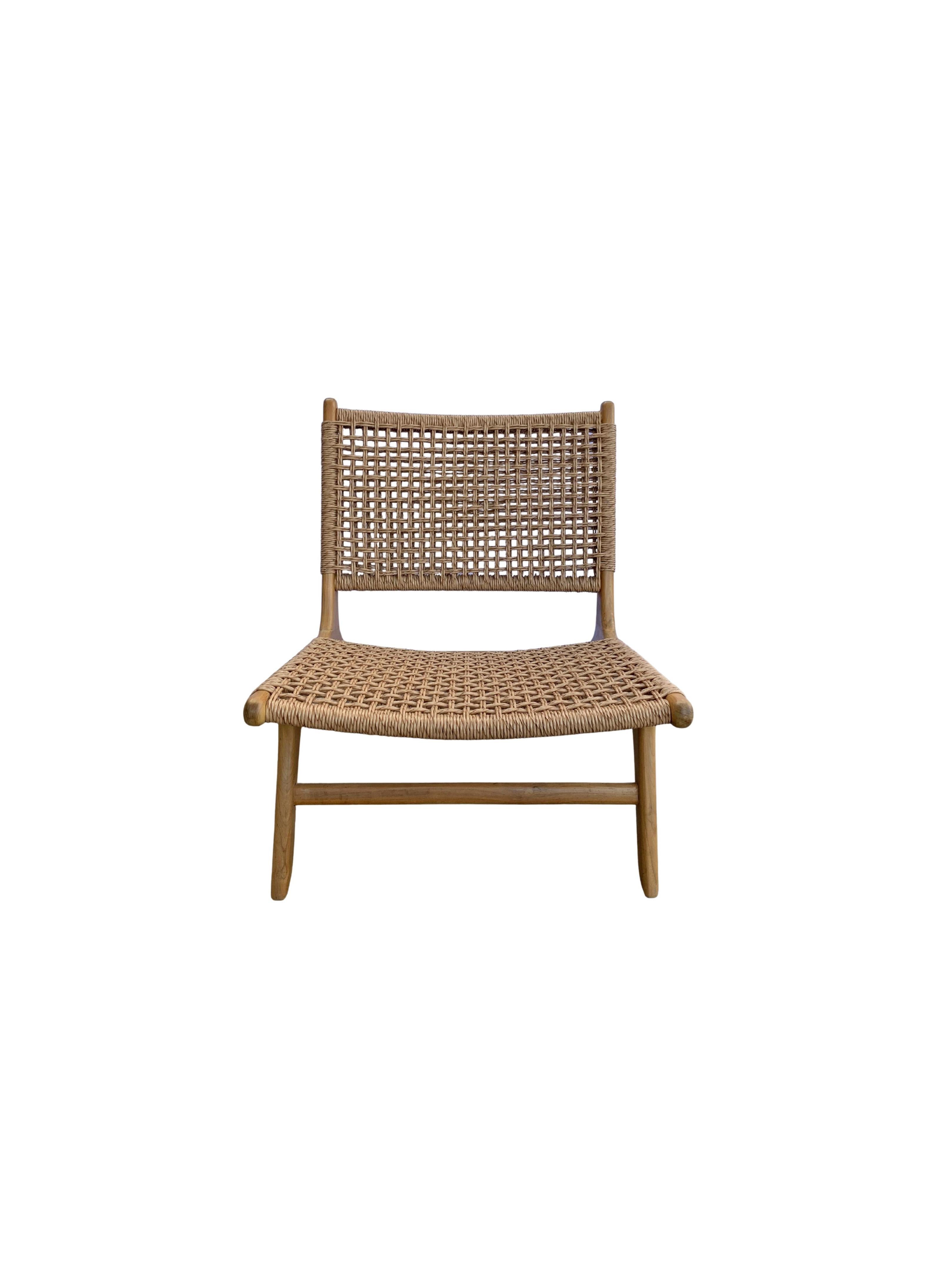 A hand-crafted teak framed & woven synthetic rattan lounger chair. These chairs are crafted by local artisans using a wood joinery technique without the use of nails. They feature a subtle wood texture and are robust and sturdy. Synthetic rattan is