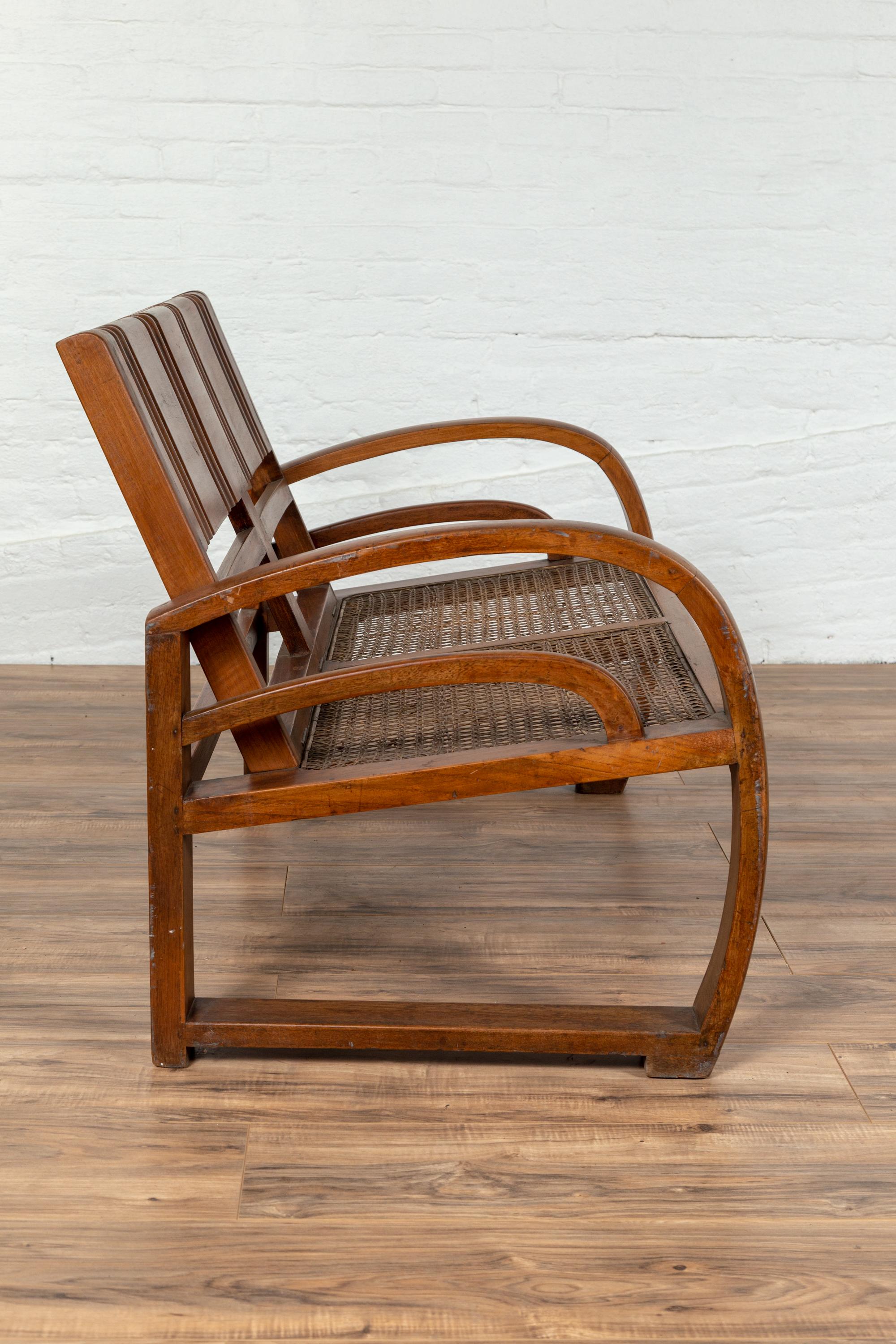 Teak Wood Settee from Madura with Folding Back, Looping Arms and Cane Seat For Sale 5