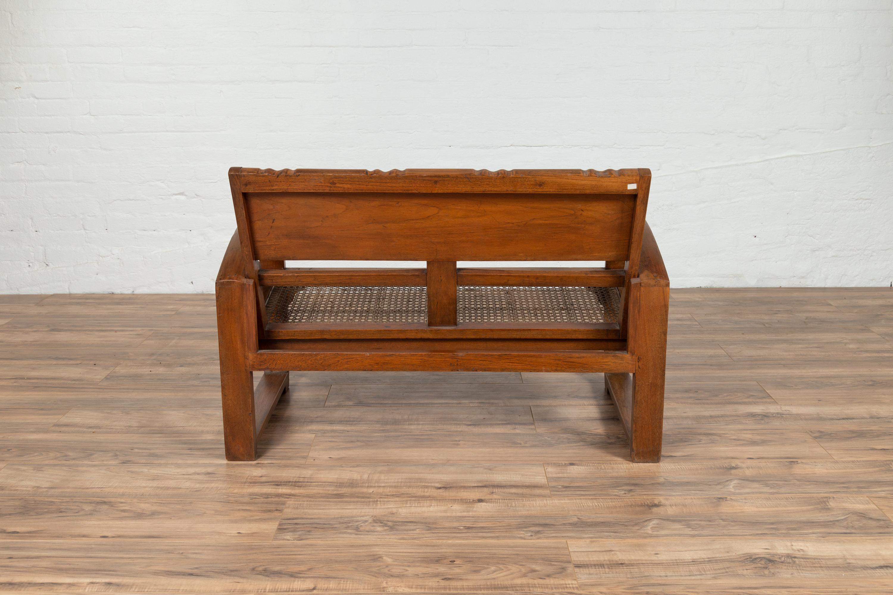 Teak Wood Settee from Madura with Folding Back, Looping Arms and Cane Seat For Sale 7