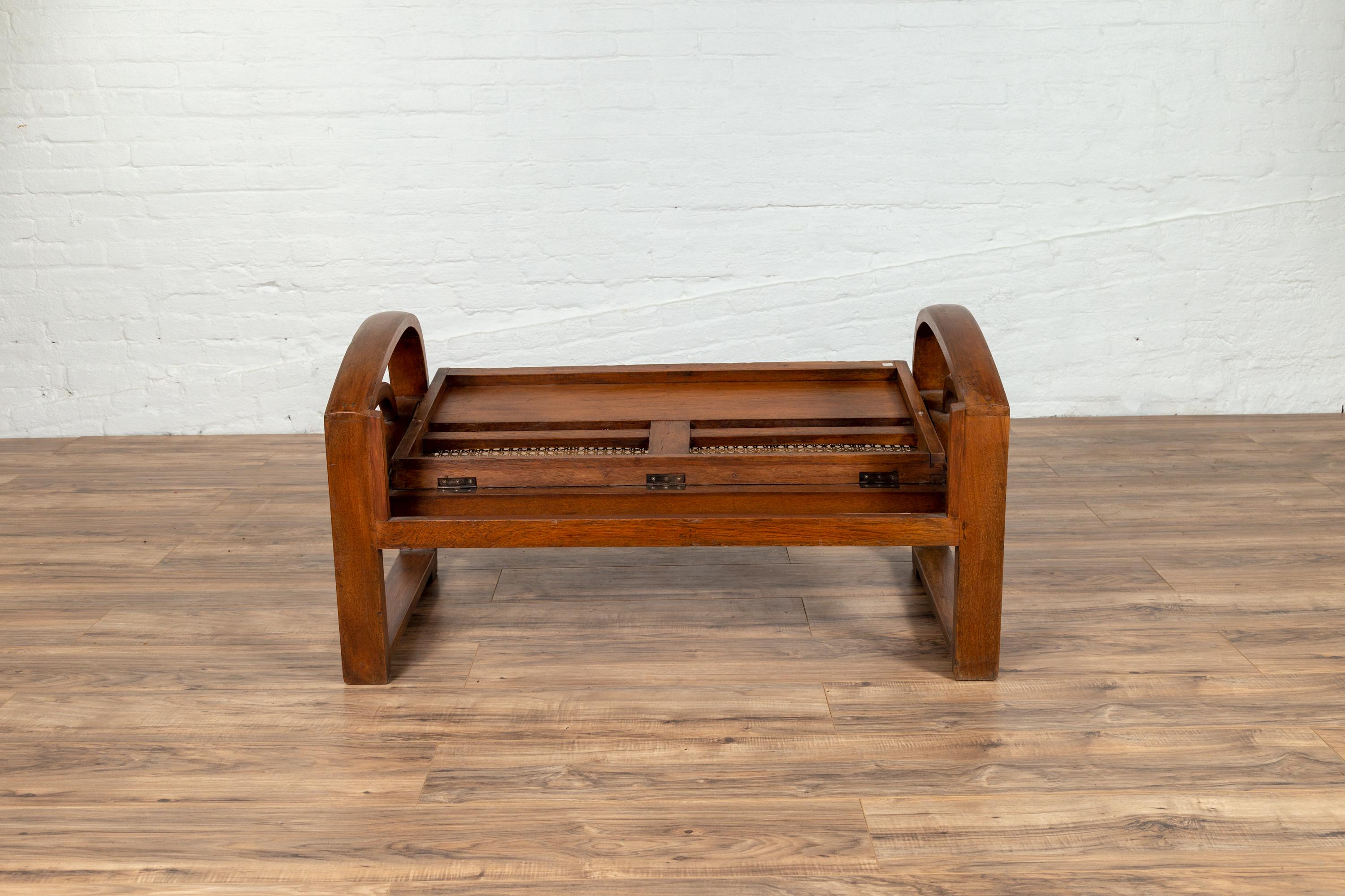 Teak Wood Settee from Madura with Folding Back, Looping Arms and Cane Seat For Sale 8