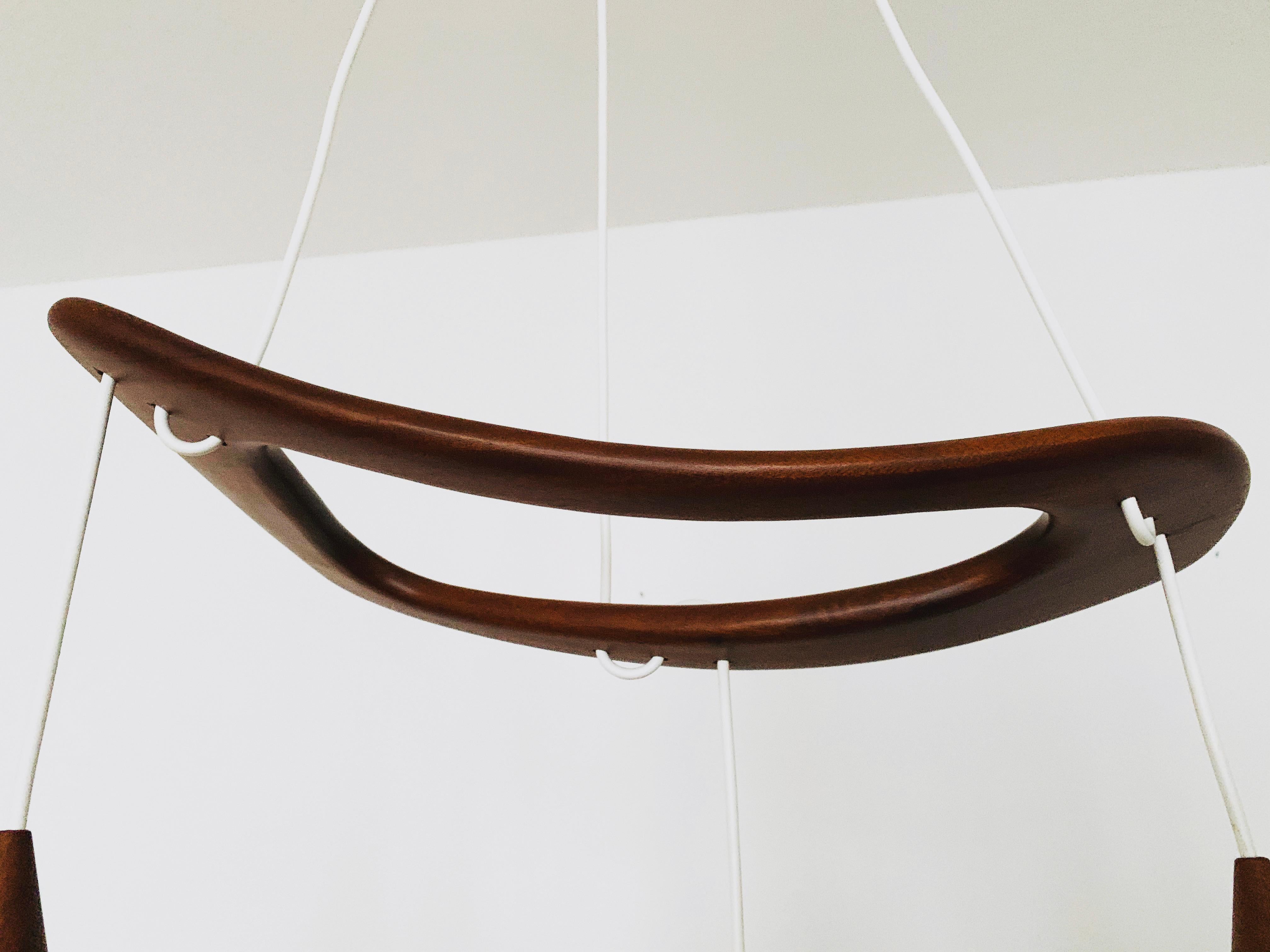 Mid-20th Century Teakwood and Raffia Bast Cascading Lamp by Jean Rispal For Sale