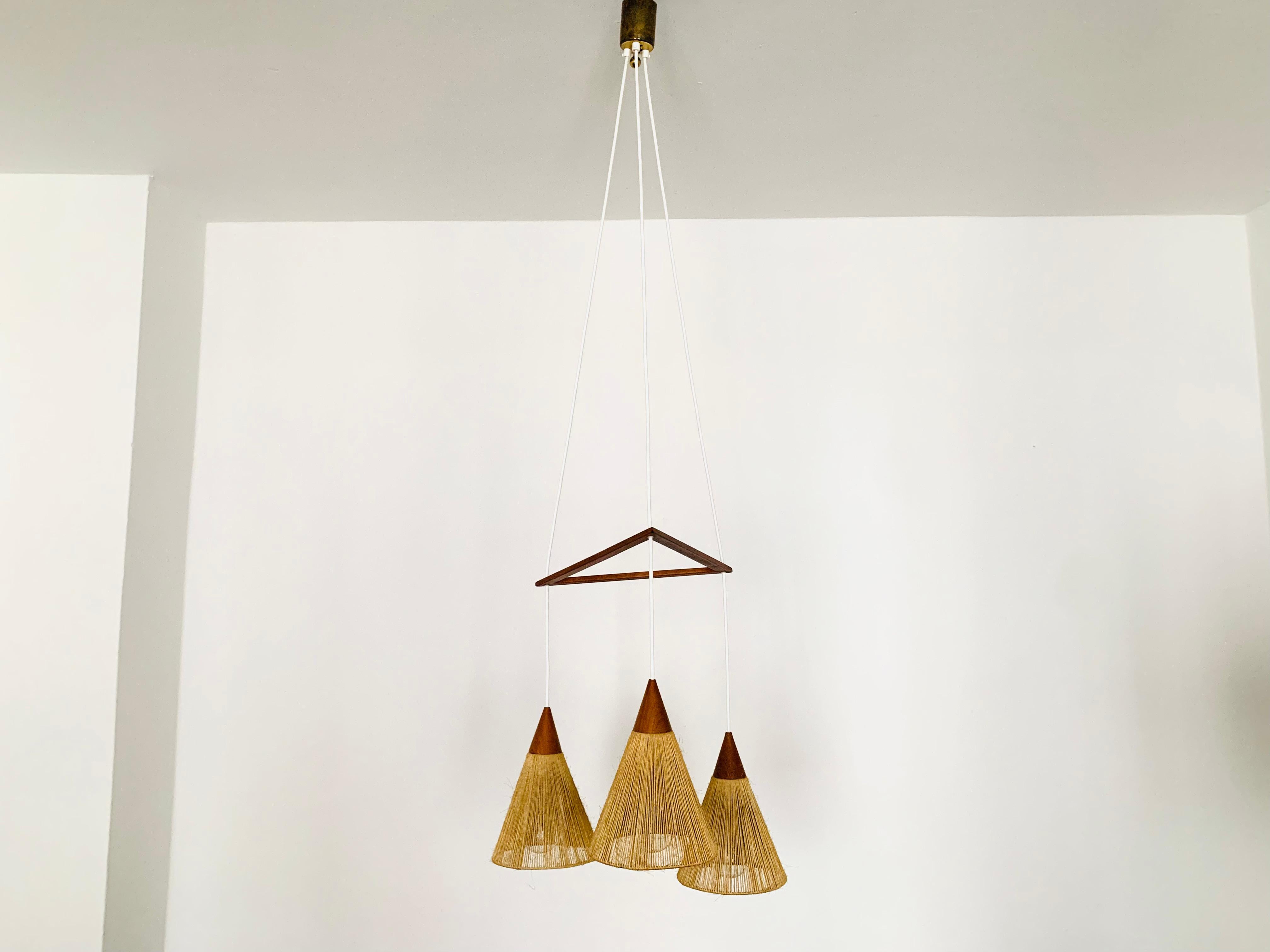 Scandinavian Modern Teakwood and raffia bast cascading lamp by Temde For Sale