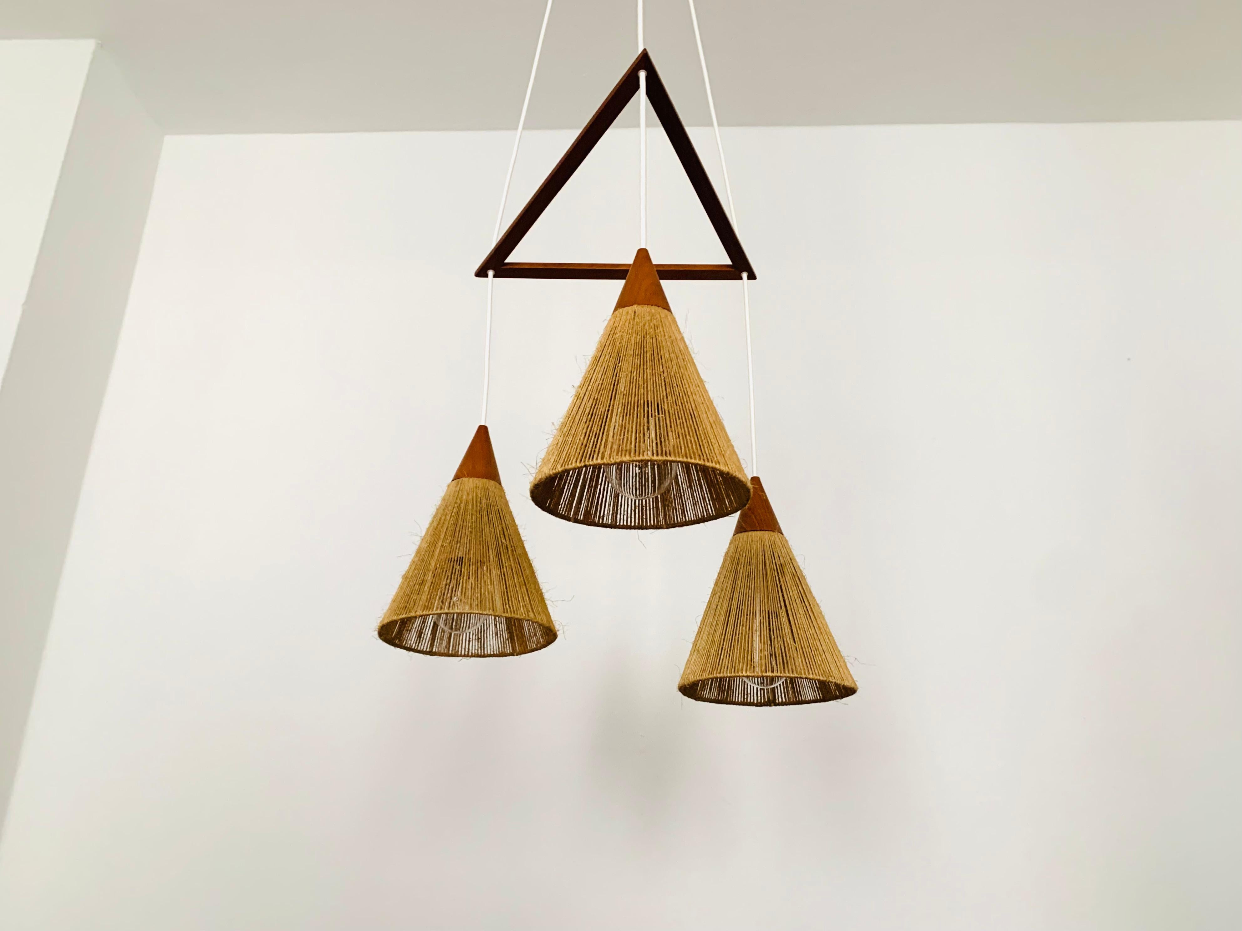 Mid-20th Century Teakwood and raffia bast cascading lamp by Temde For Sale