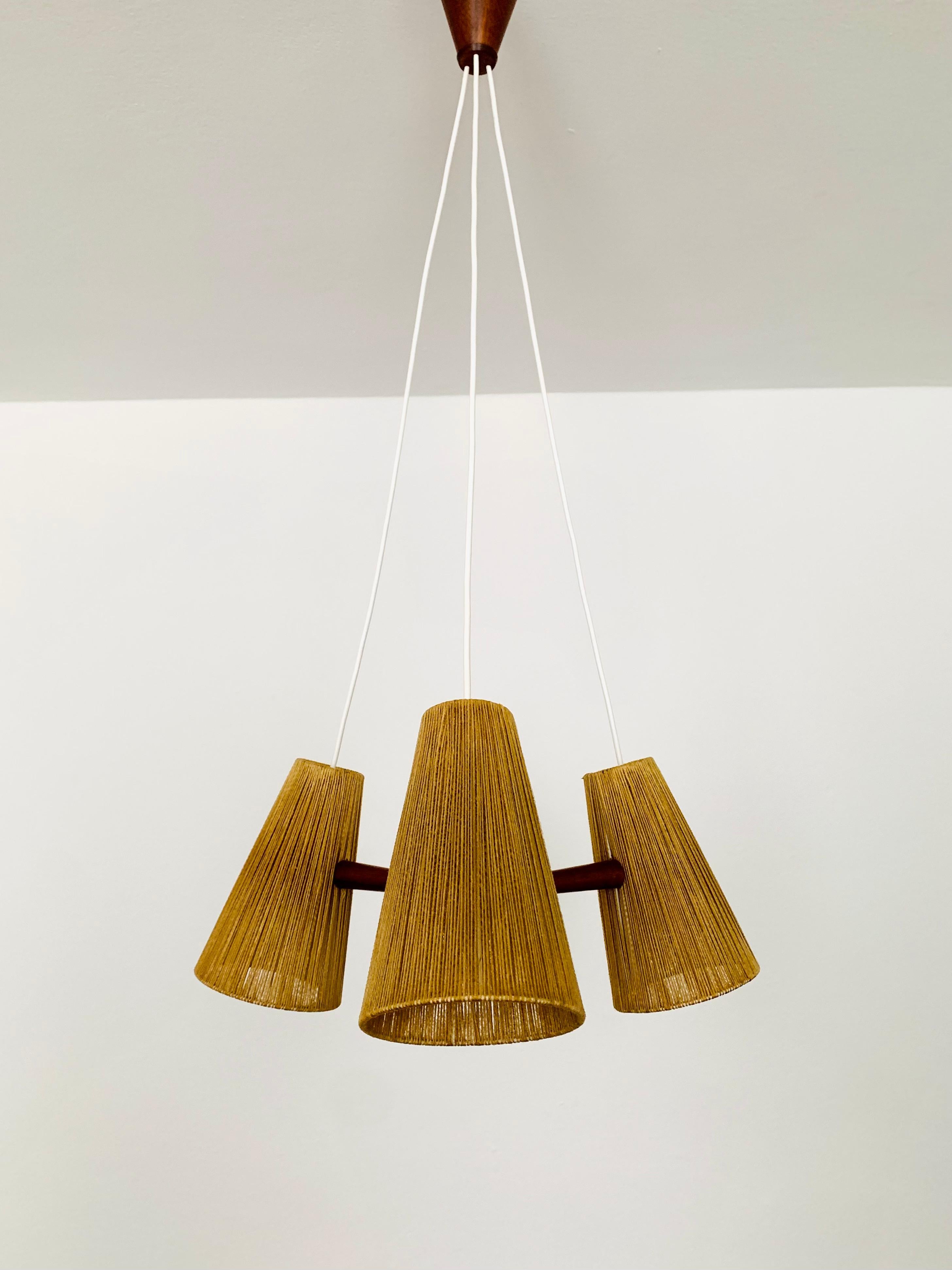 Beautiful raffia lamp from the 1960s.
Great and unusual design with a fantastically comfortable look.
Very nice teak details and high-quality workmanship.
A spectacular play of light is created.

Manufacturer: Temde

Condition:

Very good