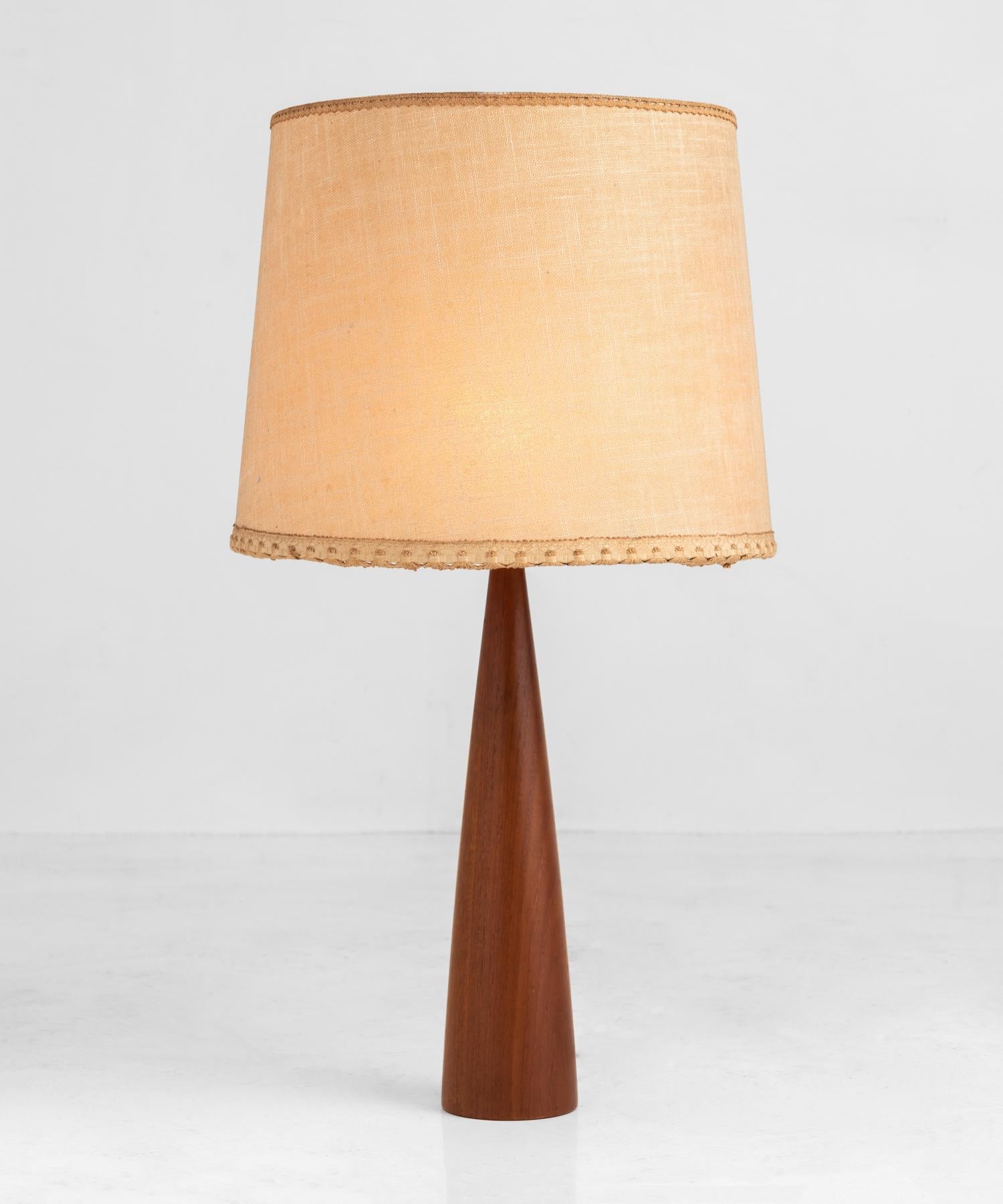 Teak wood table lamp, Italy, circa 1960.

Simple, handsome base with original cloth shade.