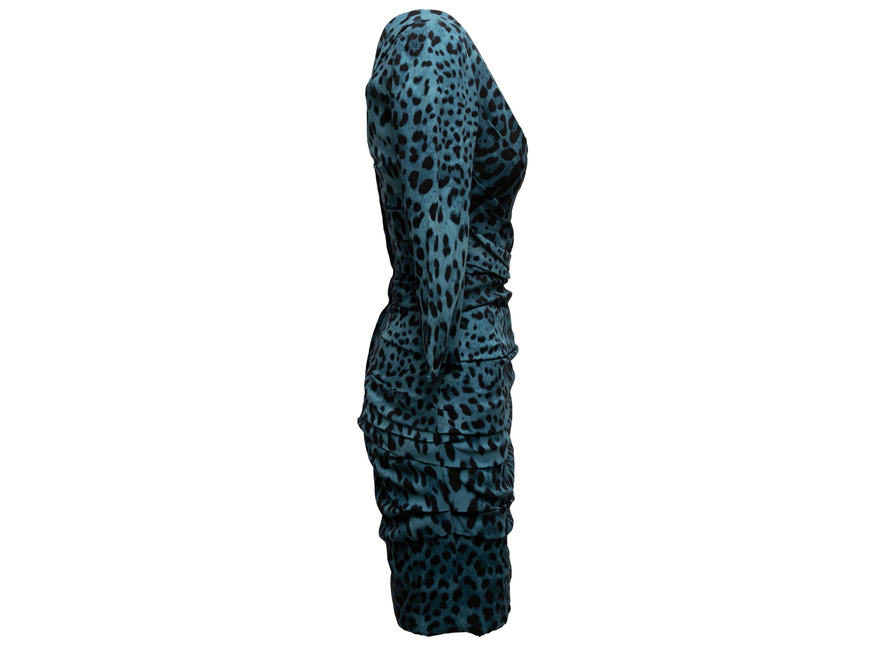 Teal and black leopard print silk dress by Dolce & Gabbana. Ruching throughout. Scoop neck. Long sleeves. Zip closure at back. 28