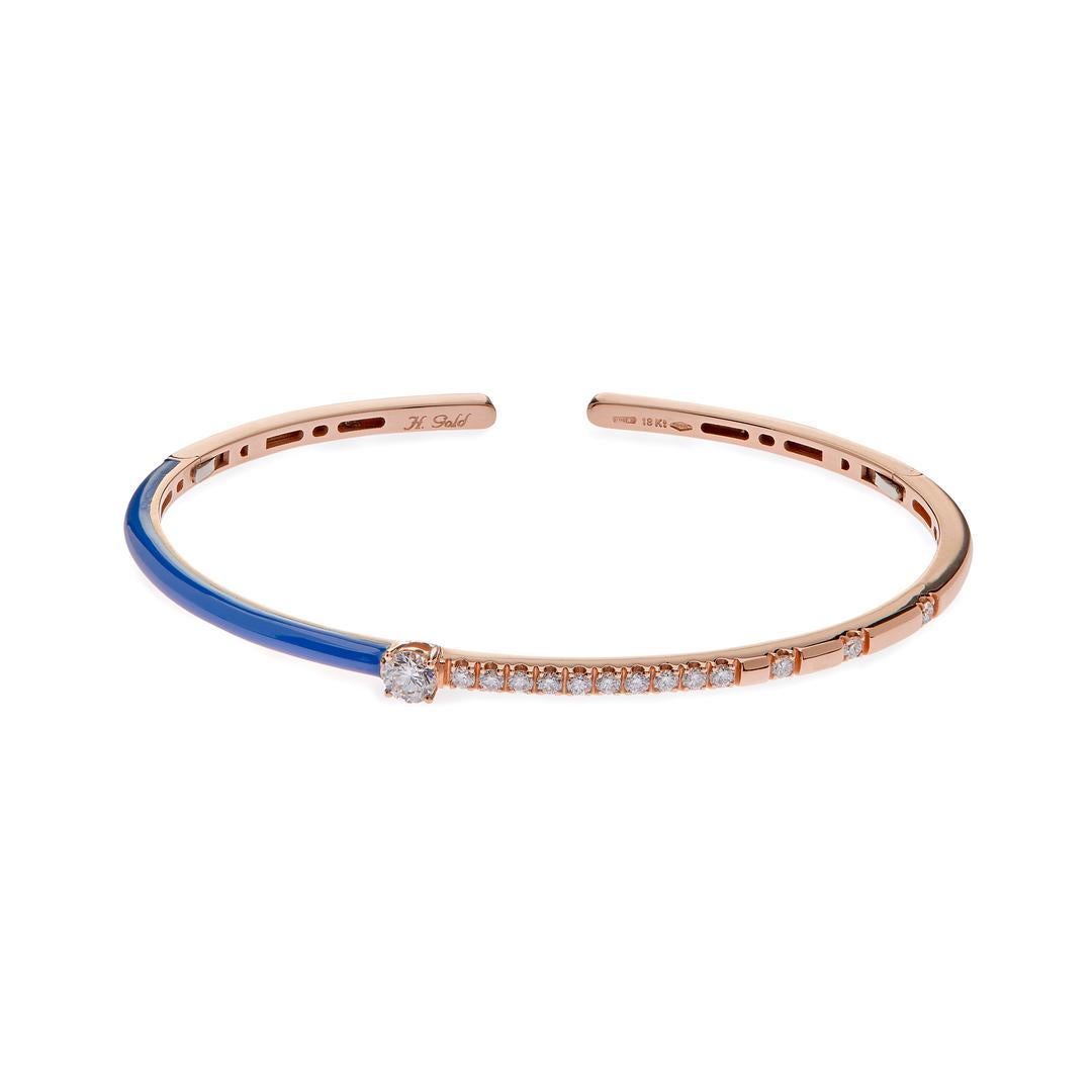 Crafted with meticulous attention to detail, this bracelet features a sleek bangle design made from luxurious 18k rose gold. The warm tones of rose gold provide a beautiful contrast to the vibrant teal enamel accents, creating a striking visual