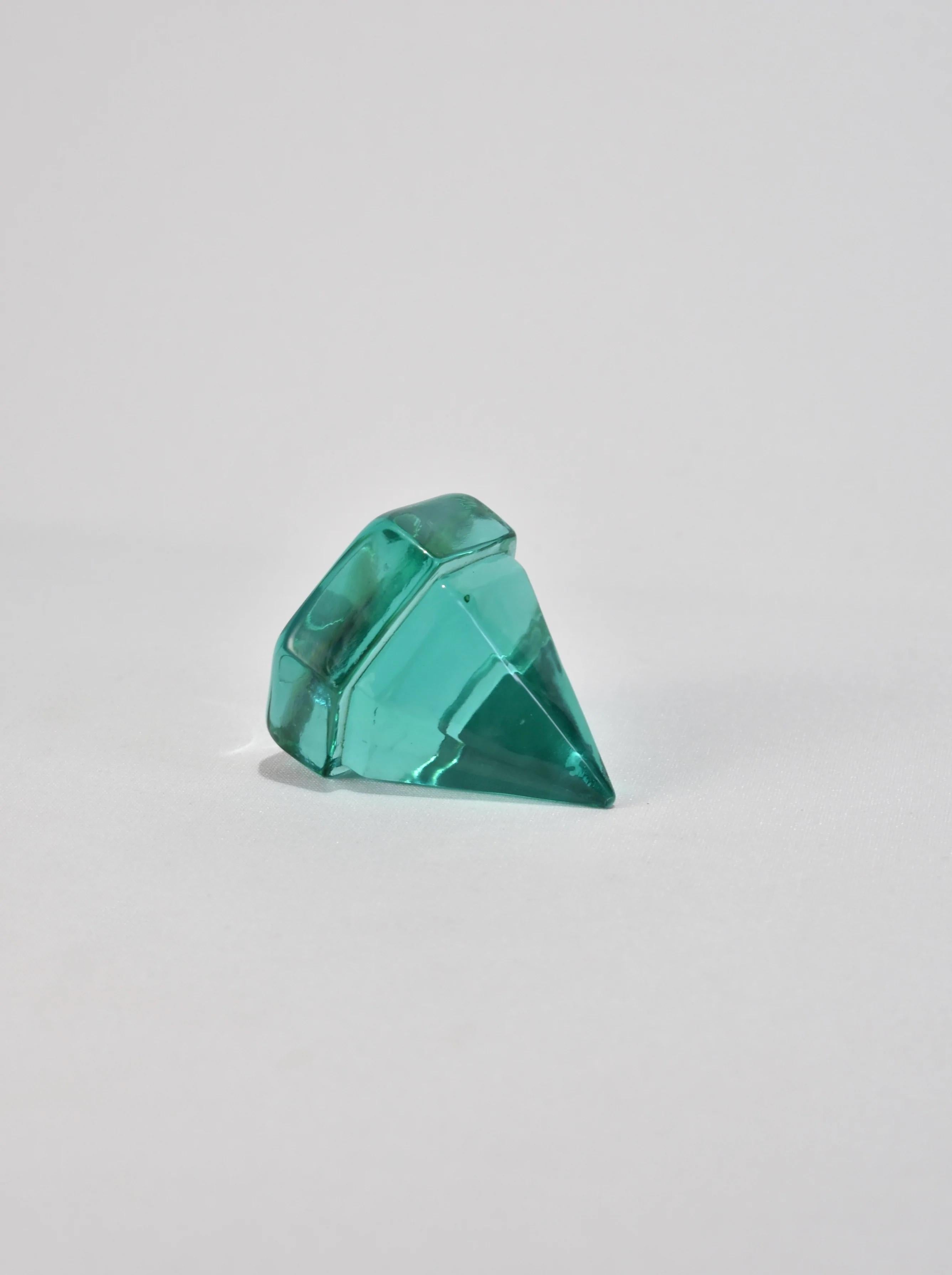 Beautiful teal glass prism. May be used as a paperweight or displayed on its own as a sculptural piece.
