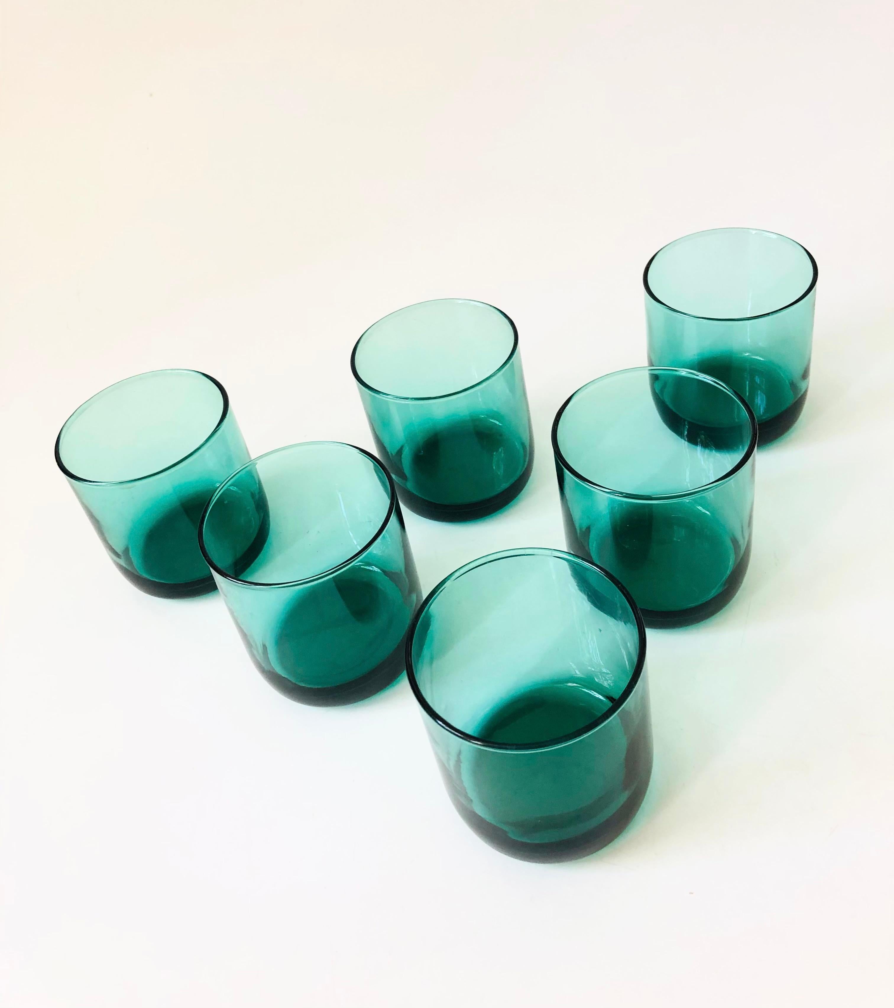 A set of 6 vintage lowball glasses in a moody dark teal color. Nice minimalist rounded shape. Made by Libbey. Perfect for using as juice glasses or for cocktails.


