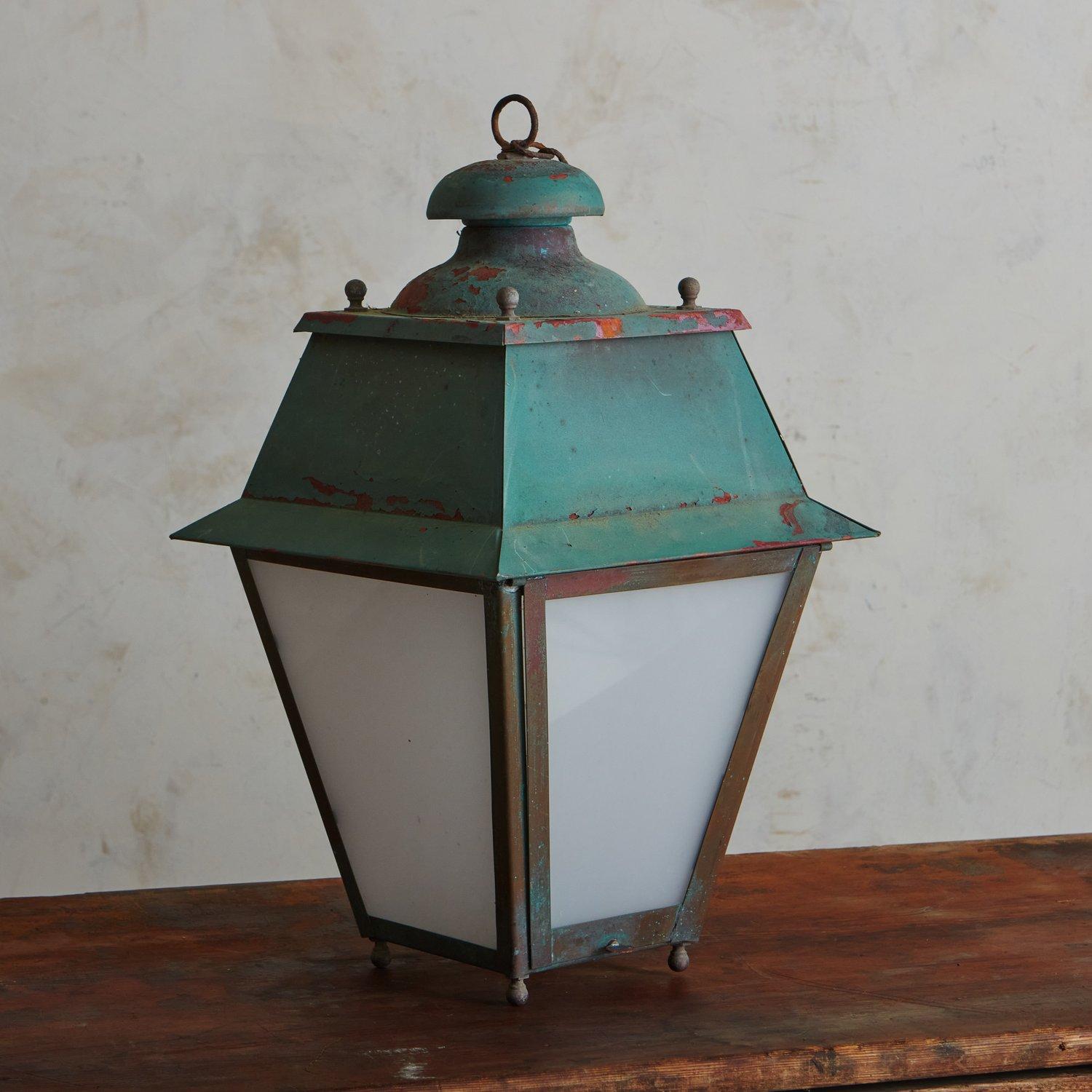 A 1950s French lantern featuring a classic profile and painted a beautiful teal hue. This fixture was constructed with metal and has four frosted glass panels. Sourced in France, 1950s.