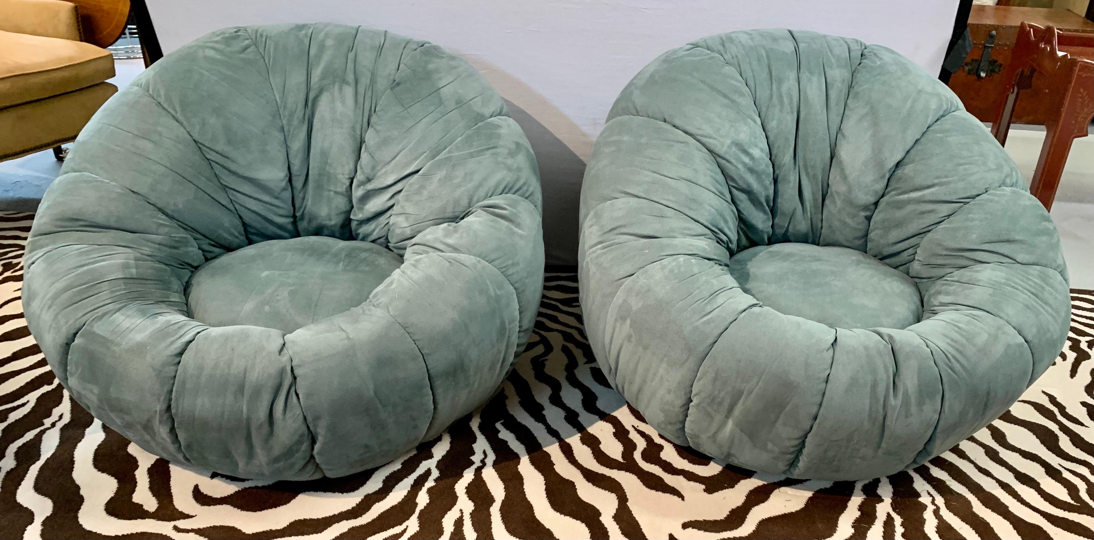 Rare pair of Post Modern round lounge chairs that match and have zippers at back. Great scale and better lines. Exceptional comfort. Fabric feels like suede leather by we believe it to be a microfiber, ableit a high quality one. Own the best.
 