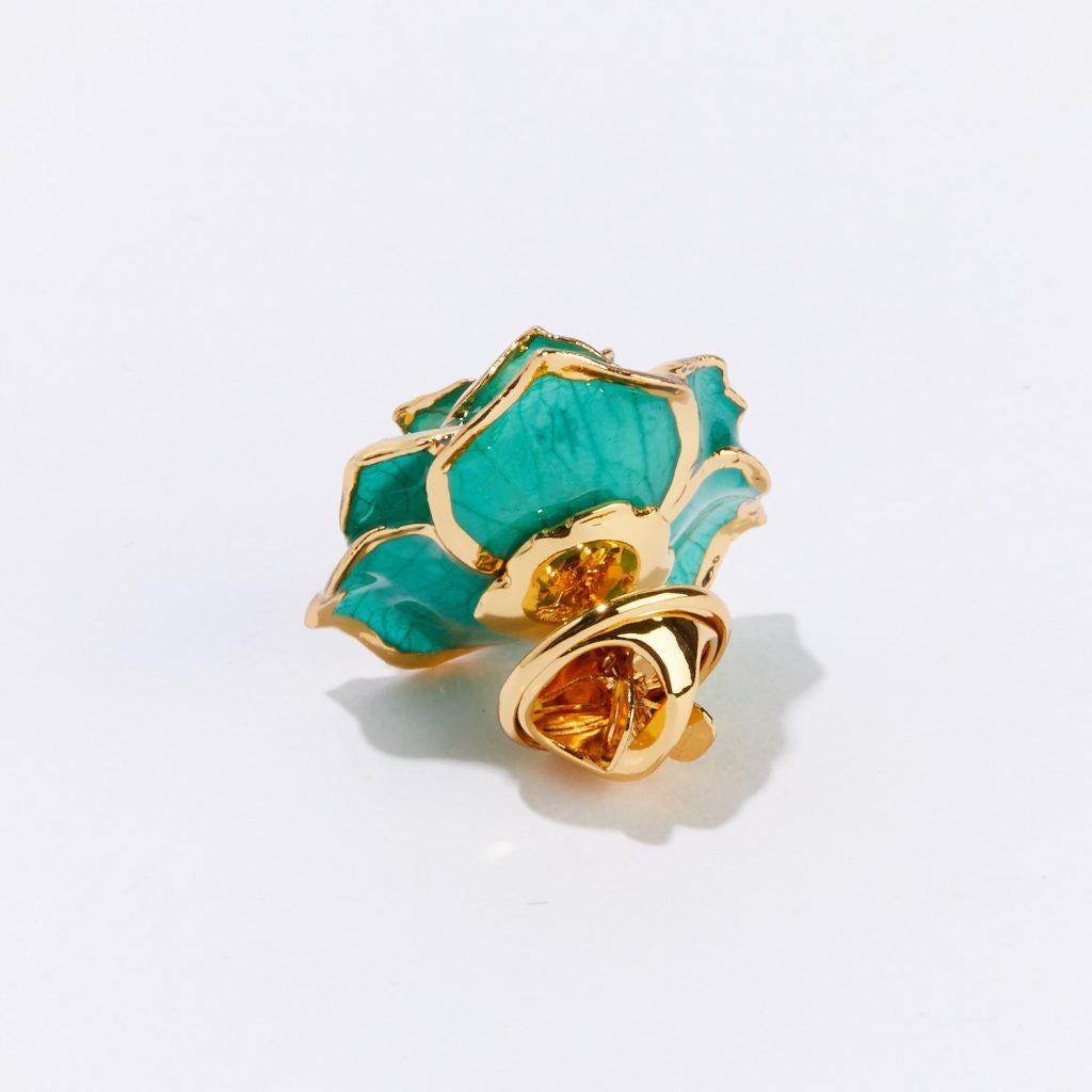 Our Teal Rhapsody Eternal Lapel Pin is both fun and whimsical—perfect for the one who likes to add a personal touch to their style. Delicately handcrafted and framed in gold, this one-of-a-kind floral treasure lets your loved one know you are