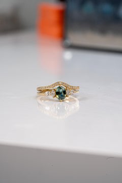 Teal Sapphire And Diamond Engagement Ring