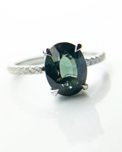 Teal sapphire & diamond engagement ring platinum