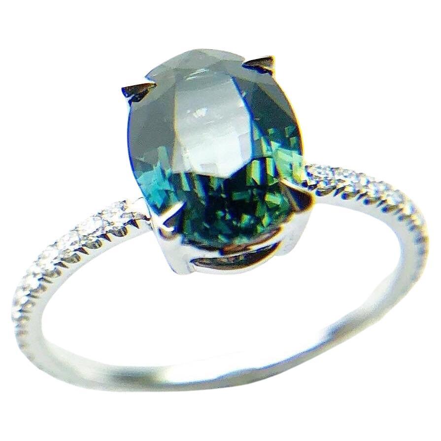 Teal sapphire & diamond engagement ring platinum