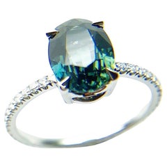 Teal sapphire & diamond engagement ring platinum
