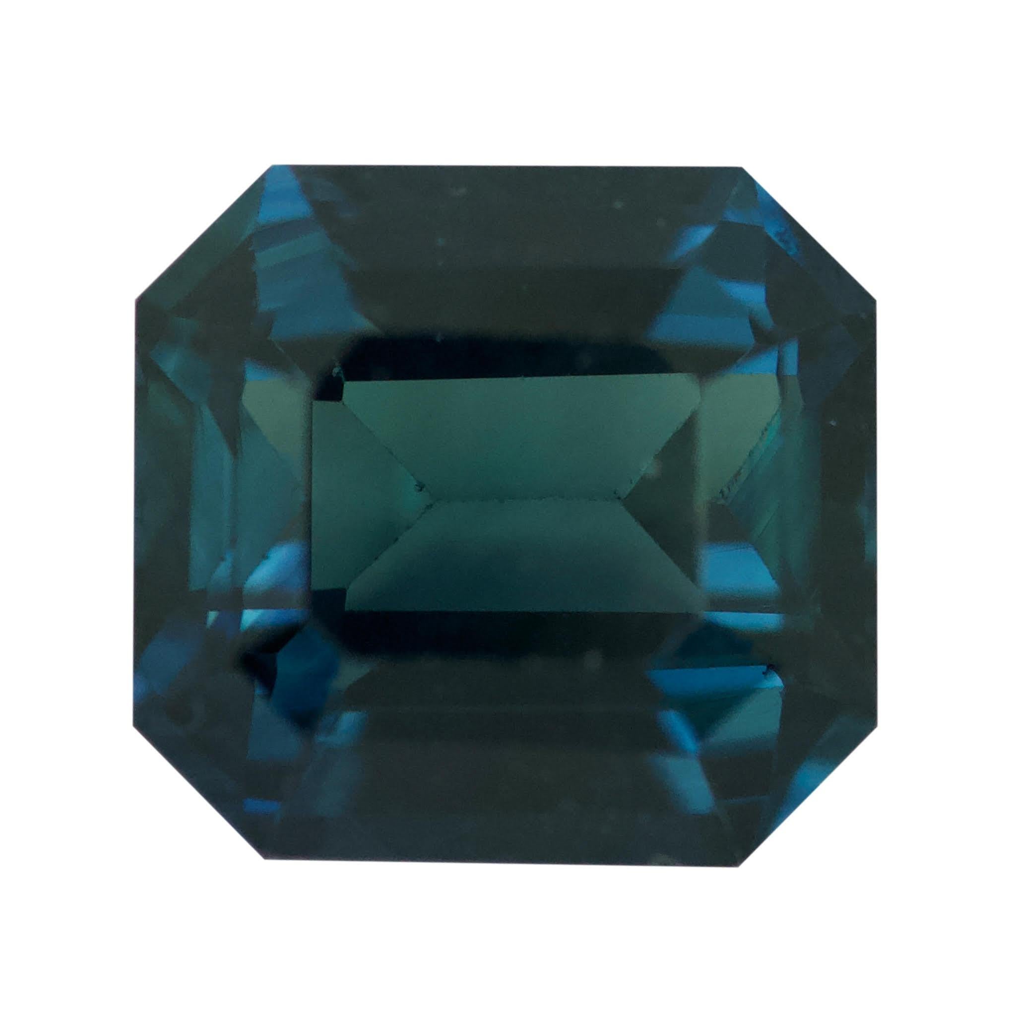 This stunning over 2 carat teal sapphire boasts a lush, deep ocean blue hue with emerald cut edges that sparkle with brilliance. Its size and intensity make it a truly impressive piece that will bring a touch of luxury to any occasion.

Colour and