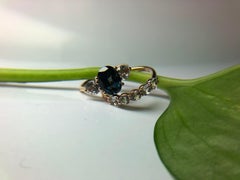 Teal sapphire three stone ring 18KT gold
