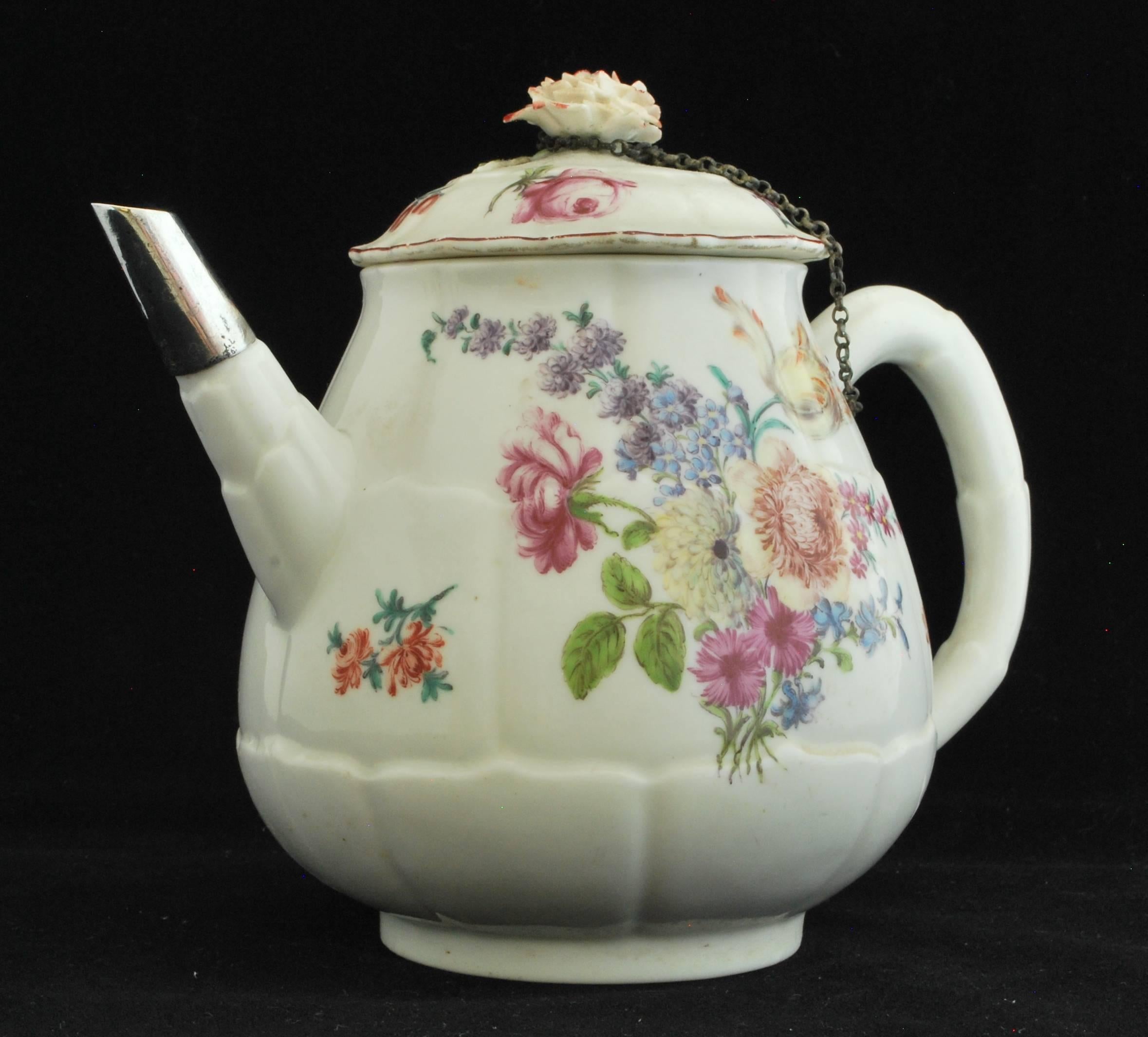 An unusual artichoke-shaped teapot, decorated with typical red anchor period flower painting including a lovely yellow tulip. The 