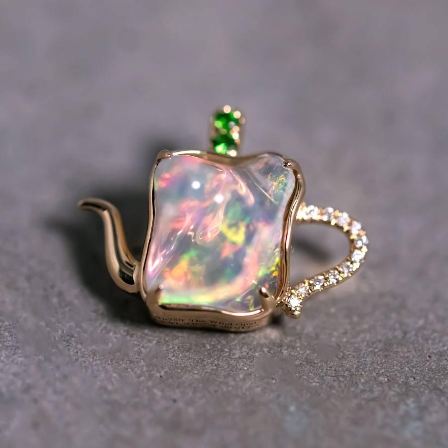 One of Kind Teapot Design Mexican Fire Opal Diamond, Tsavorite Pendant Necklace 18K Yellow Gold.


Free Domestic USPS First Class Shipping! Free Gift Bag or Box with every order!

Opal—the queen of gemstones, is one of the most beautiful gemstones