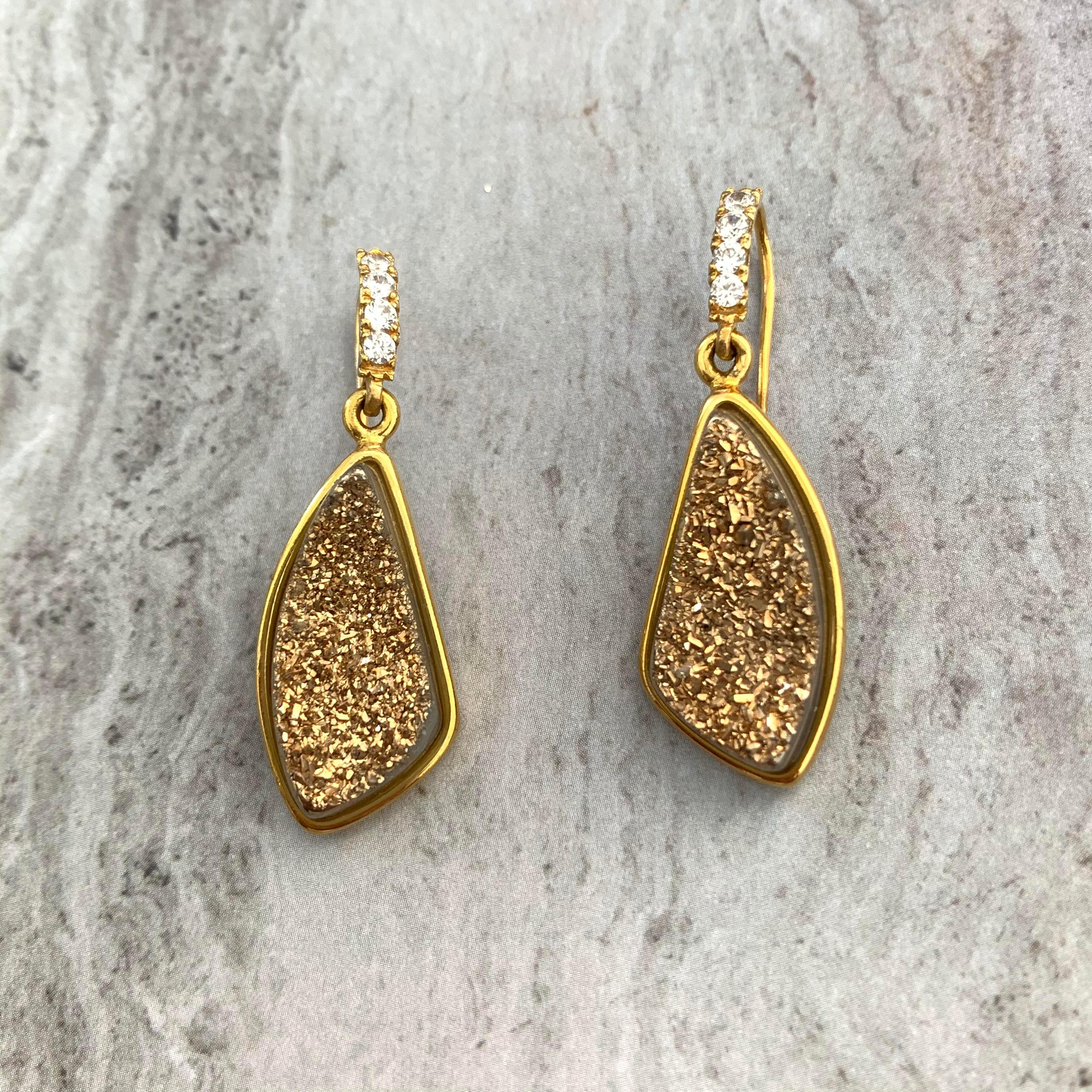 Stunning and unique tear drop golden druzy hook earrings. 

The druzy each measures 14x25mm. 

Hook is adorned with round simulated diamond and set in 18k gold vermeil over sterling silver. 

Total height: 1-1.2