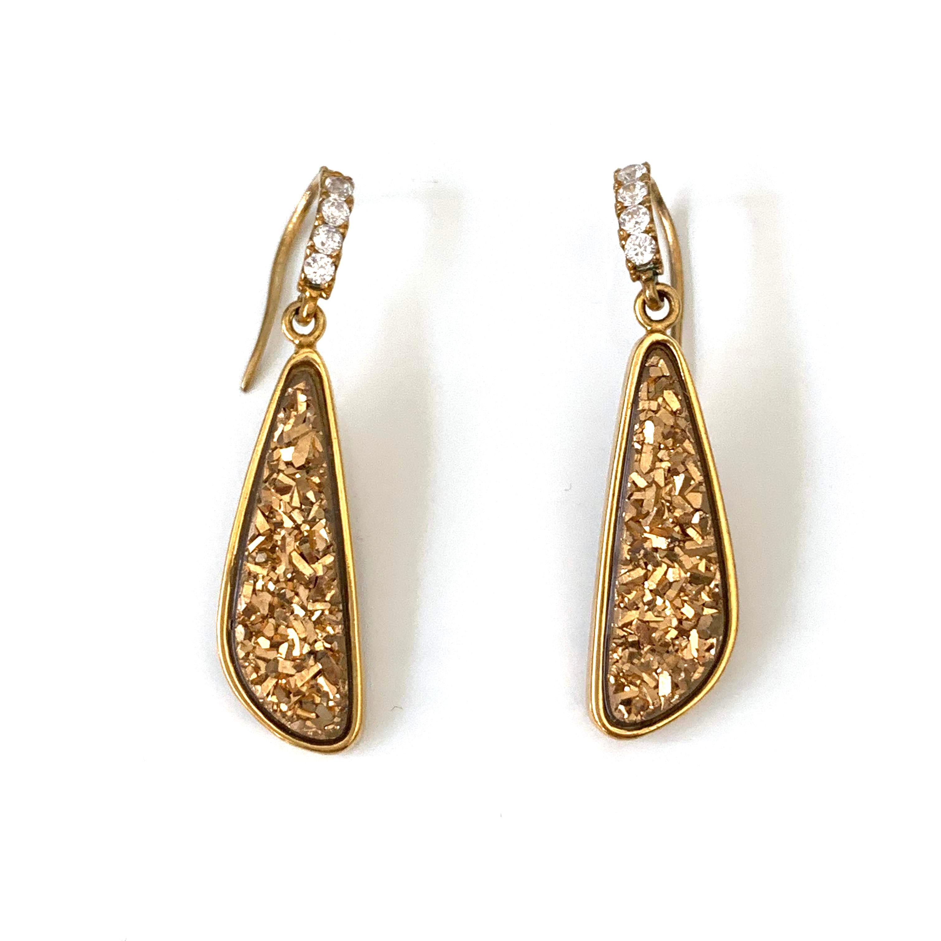 Stunning and unique tear drop golden druzy hook earrings. 

The druzy each measures 9x25mm. 

Hook is adorned with round simulated diamond and set in 18k gold vermeil over sterling silver. 

Total height: 1-3/4
