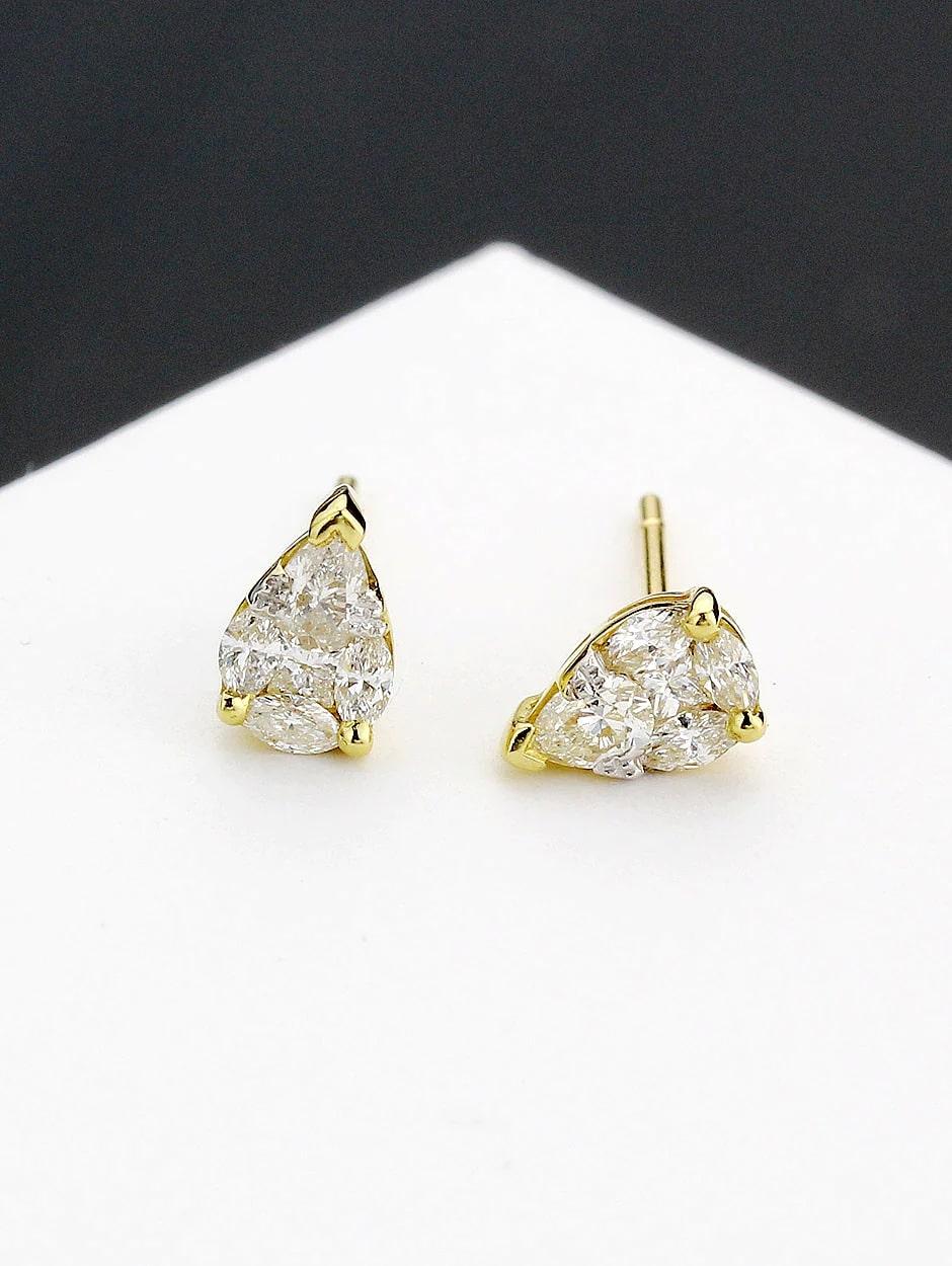 Tear drop design illusion style earring including pear shape, princess and marquise cup diamond, all with a high polish finish. Available in 18K Yellow Gold.

Earring Information
Diamond Type : Natural Diamond
Metal : 18K
Metal Color : Yellow