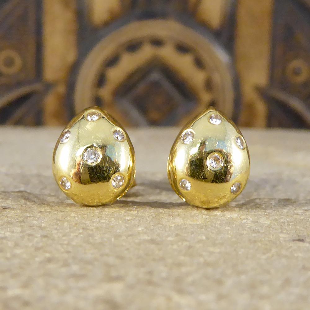 Cute little contemporary earrings that have been hand crafted from 18ct Yellow Gold with butterfly backs. With 6 small diamonds in each stud there is a total of 0.12cts in both earrings. A lovely quality set that can be worn daily.

Diamond