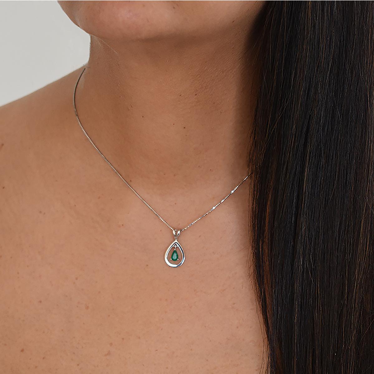 The beautiful quality of this pear shape natural Colombian emerald creates a vibrant green color full of life that stands up and is the center of attention of this fabulous pendant. The emerald is beautifully set in a fine and delicate 18K white