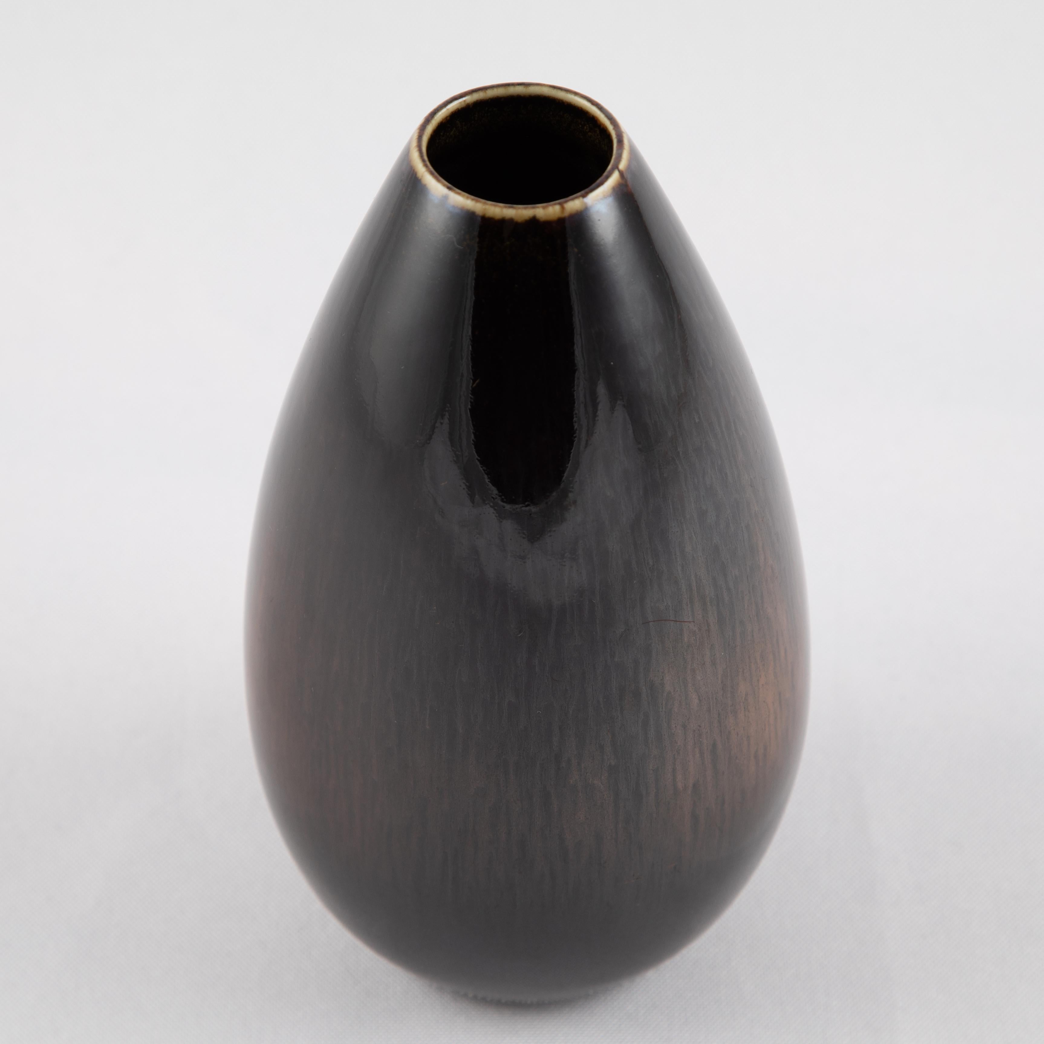 Elegant teardrop-form vase with rich brown glazes by Carl-Harry Stålhane for Rörstrand. Signed with the Rörstrand 