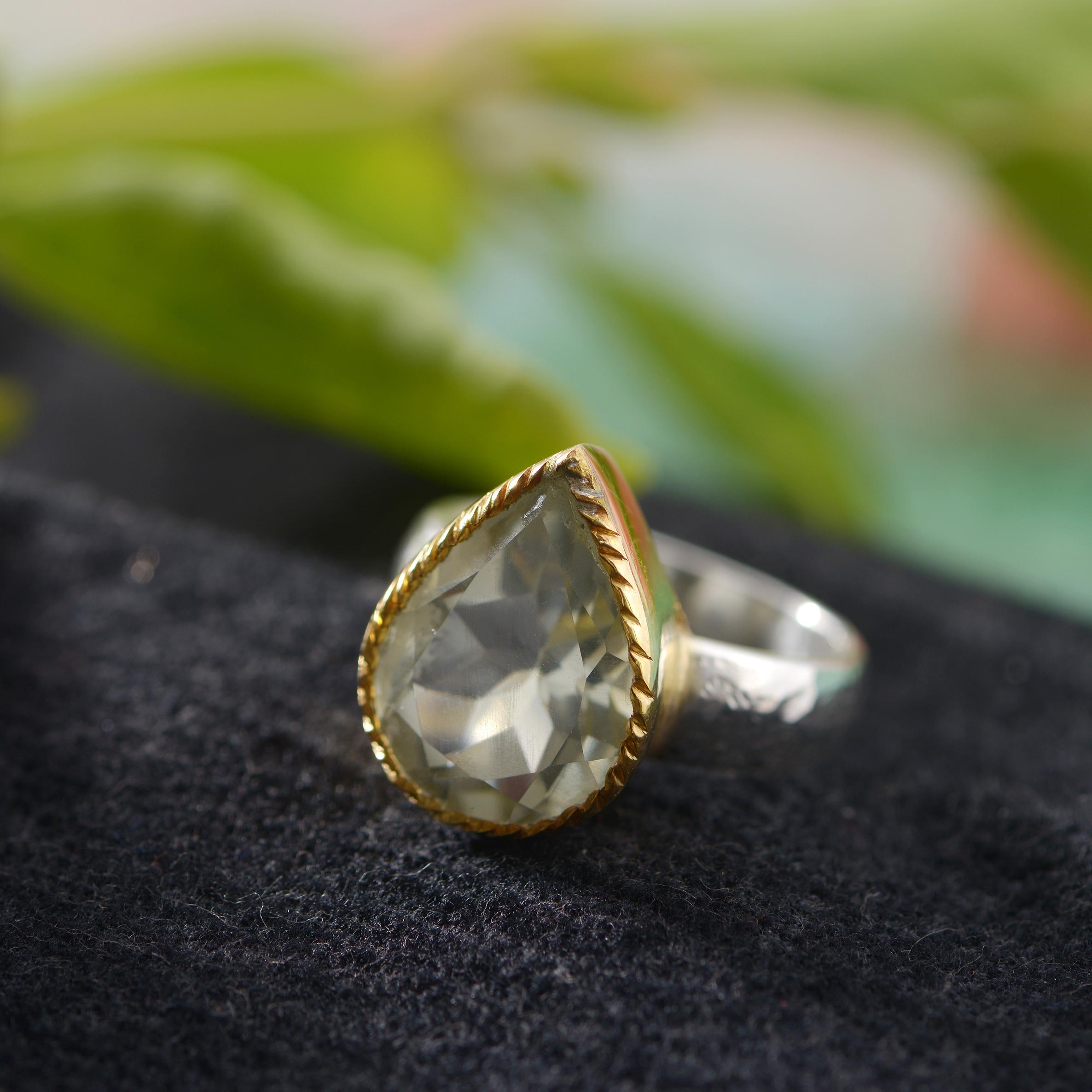 A lovely limited edition pear shaped handmade green amethyst ring.

The ring is part of a limited edition and has matching earrings and pendant. It is made in sterling silver with a hammered shank and the top of the ring is coated in 24k gold