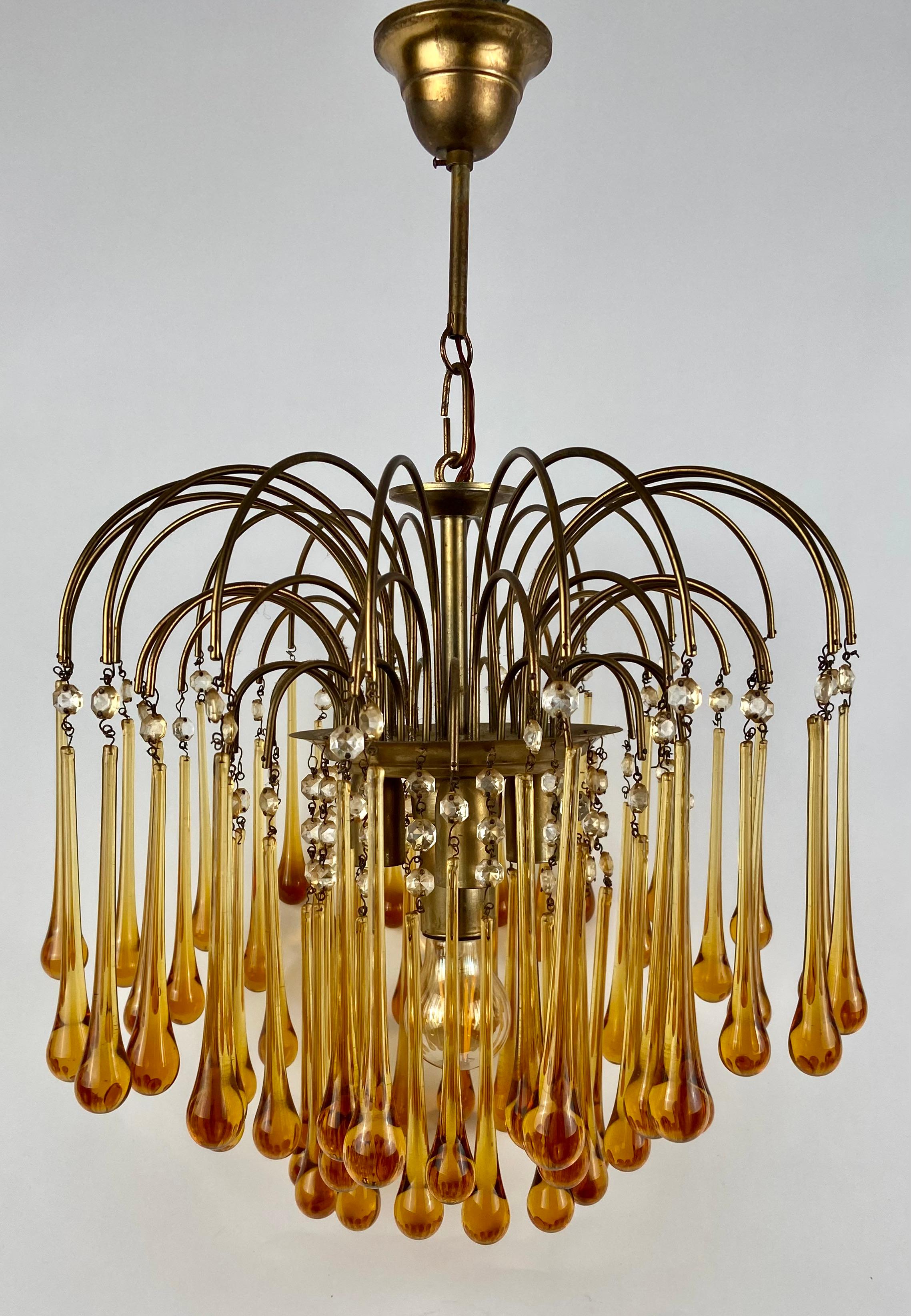 Ceiling lamp with glass teardrops in the warm color cognac. 
The brass base holds 4 light bulbs. France, circa 1930. 