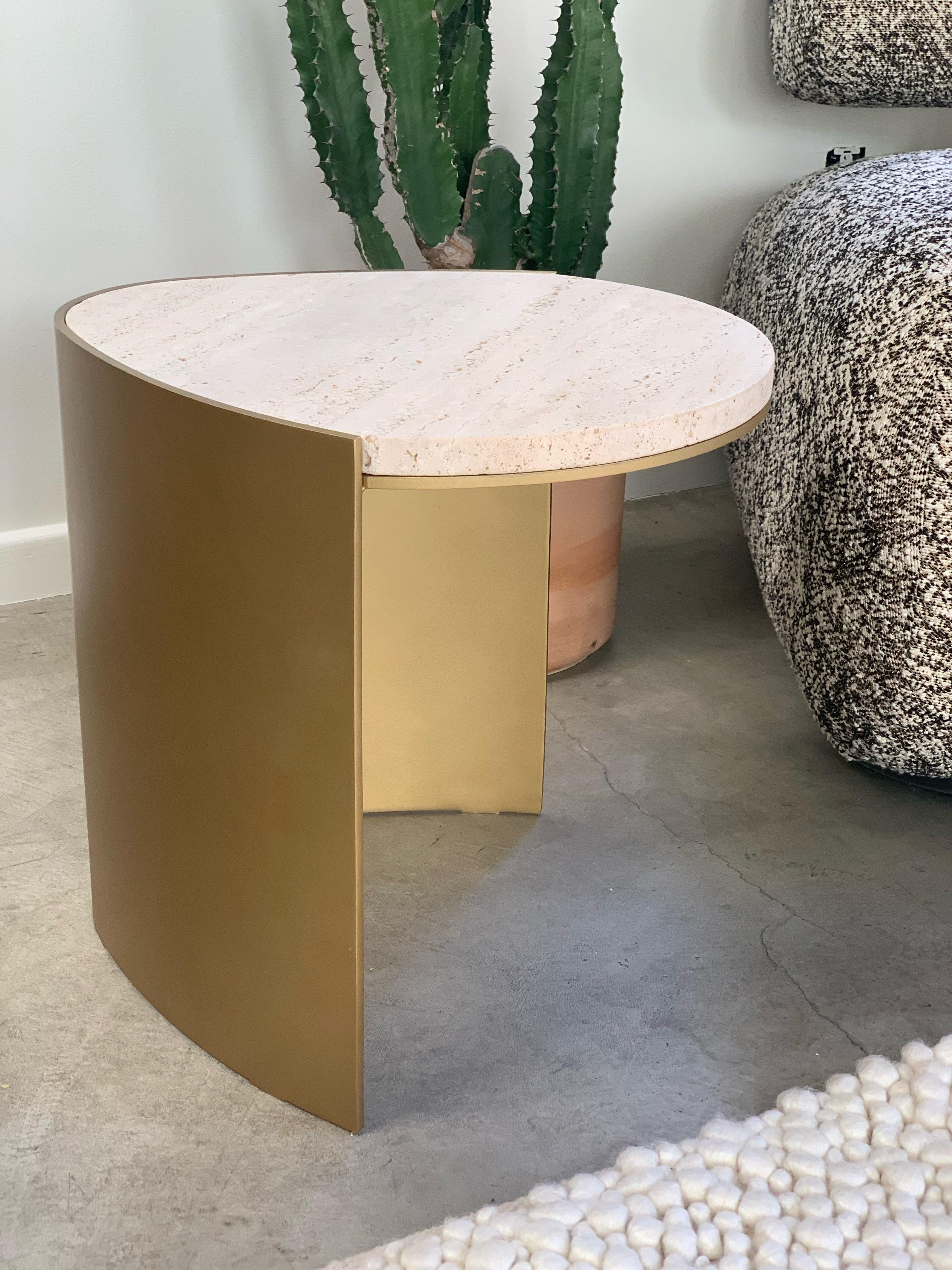 Teardrop marble side table by Atra Design
Dimensions: D 45 x W 38 x H 40 cm
Materials: Travertine Navona, pavonado brass
Other marbles and stones available.

Atra Design
We are Atra, a furniture brand produced by Atra form a mexico city–based high