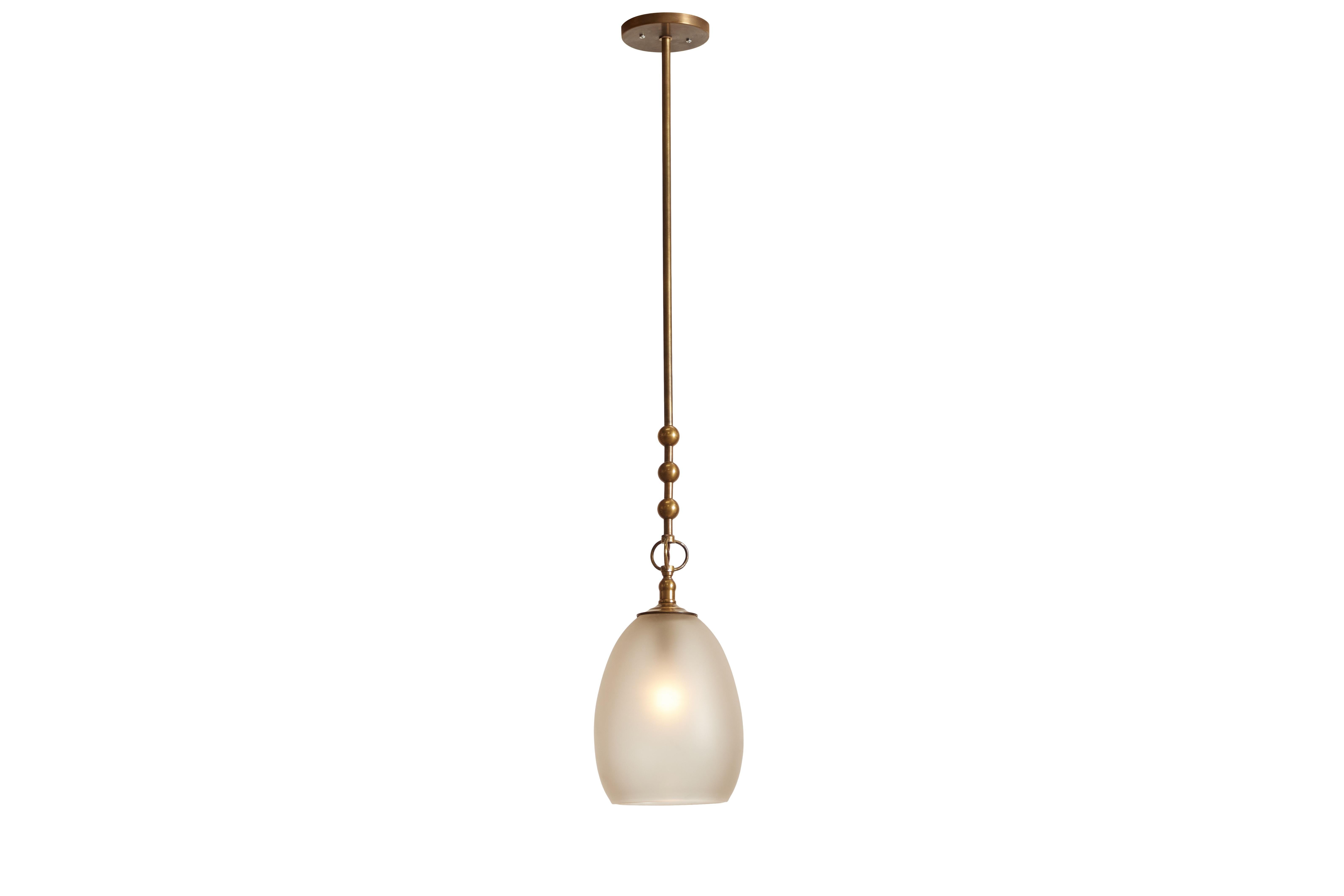 The Pearl pendant features hand blown frosted glass in a teardrop shade with an unlacquered brass metal finish. Our take on a pearl earring.
 
DIMENSIONS: 42.5