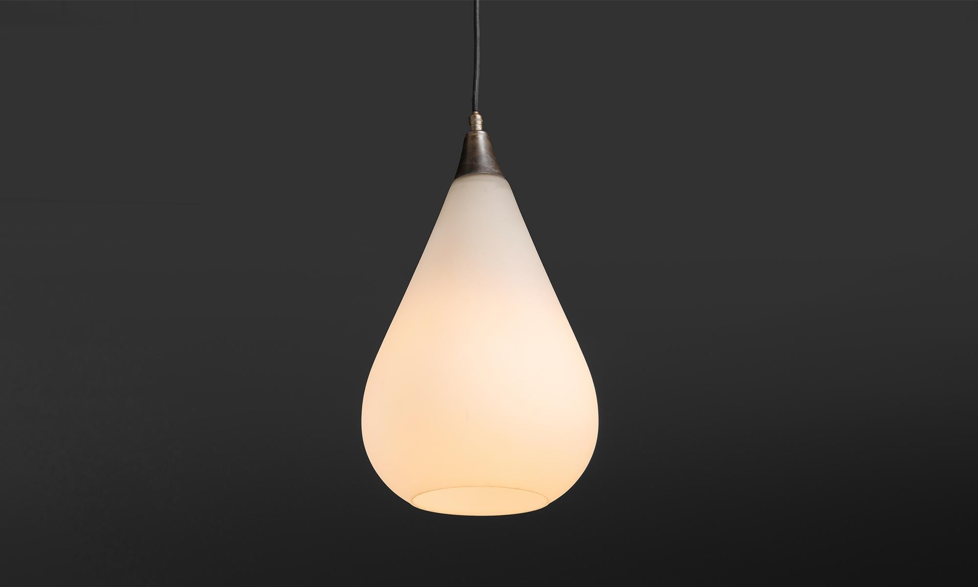 Italy circa 1940
Tear drop shaped pendant with brass fixture and opaline glass
7