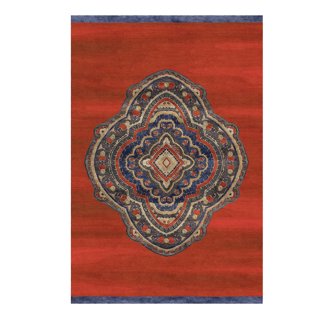 Inspired by Buddhist mandalas, this rug's sinuous, floral design evokes the dynamic images seen through a kaleidoscope. The intricate design is vibrantly colored, boasting deep crimson, pale blue, and warm beige. Set against a vivid red background,