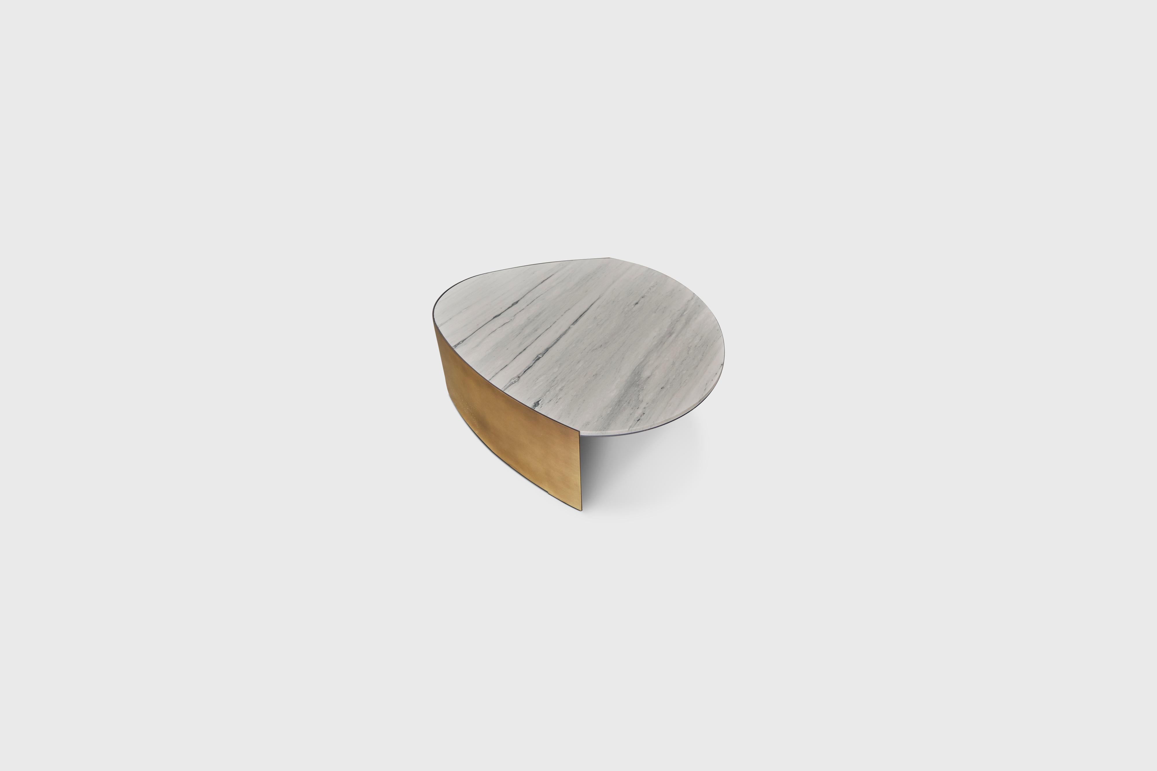 Teardrop Stone & Gold Painted Steel Base Coffee Table by ATRA

Designed by Alexander Diaz Andersson

Size:
L 120.0cm/47.2”
W 120.0cm/47.2”
H 35.0cm/13.7”

All our items are customizable to your preferred finish.