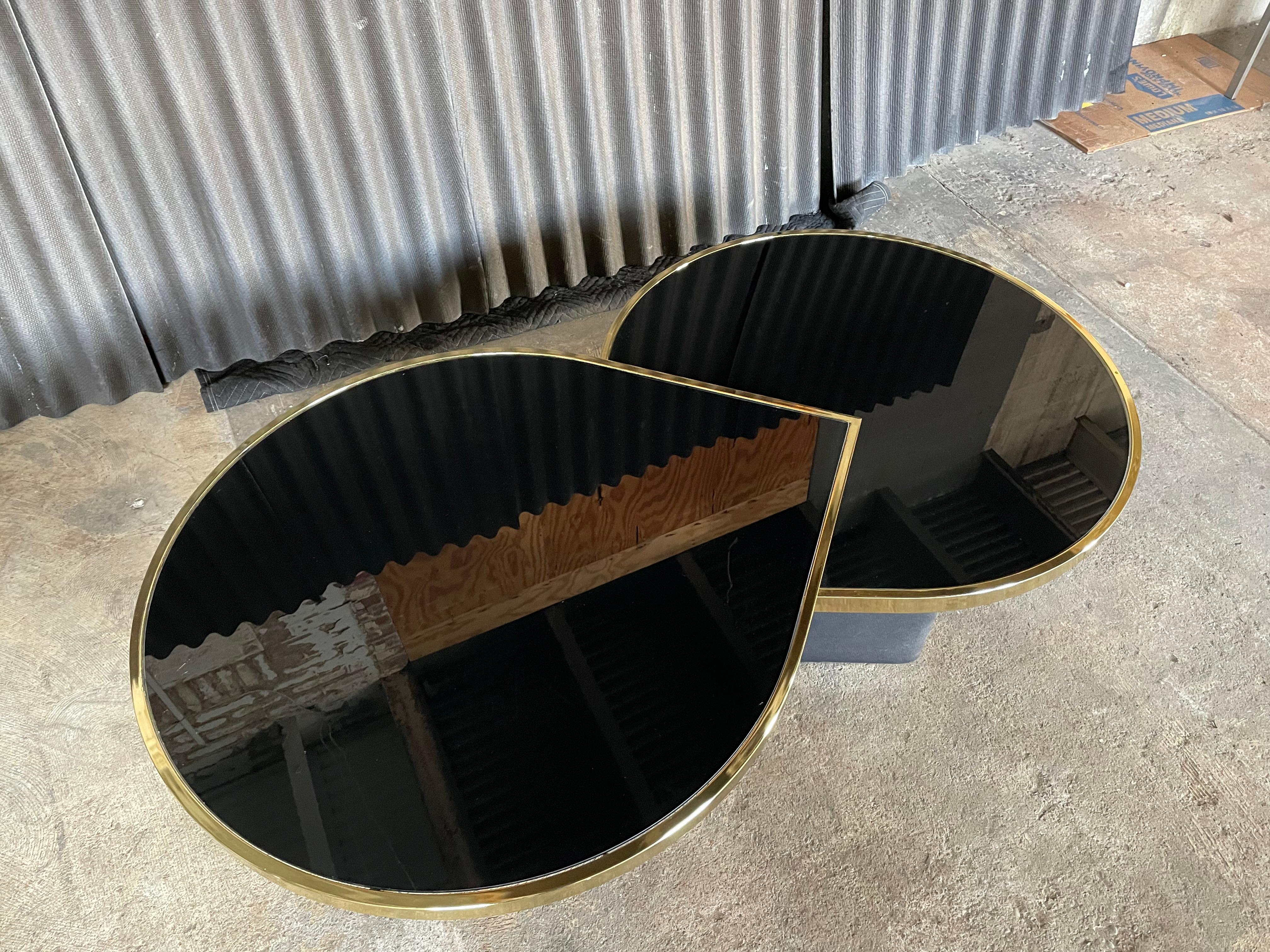 Sought after Tear Drop Swivel Cocktail by Design Institute of America(DIA).
Table swivels smoothly and perfectly as it should.
Brass plating is in very good condition with no chipping or peeling.
Glass has no breaks or chips. Minor