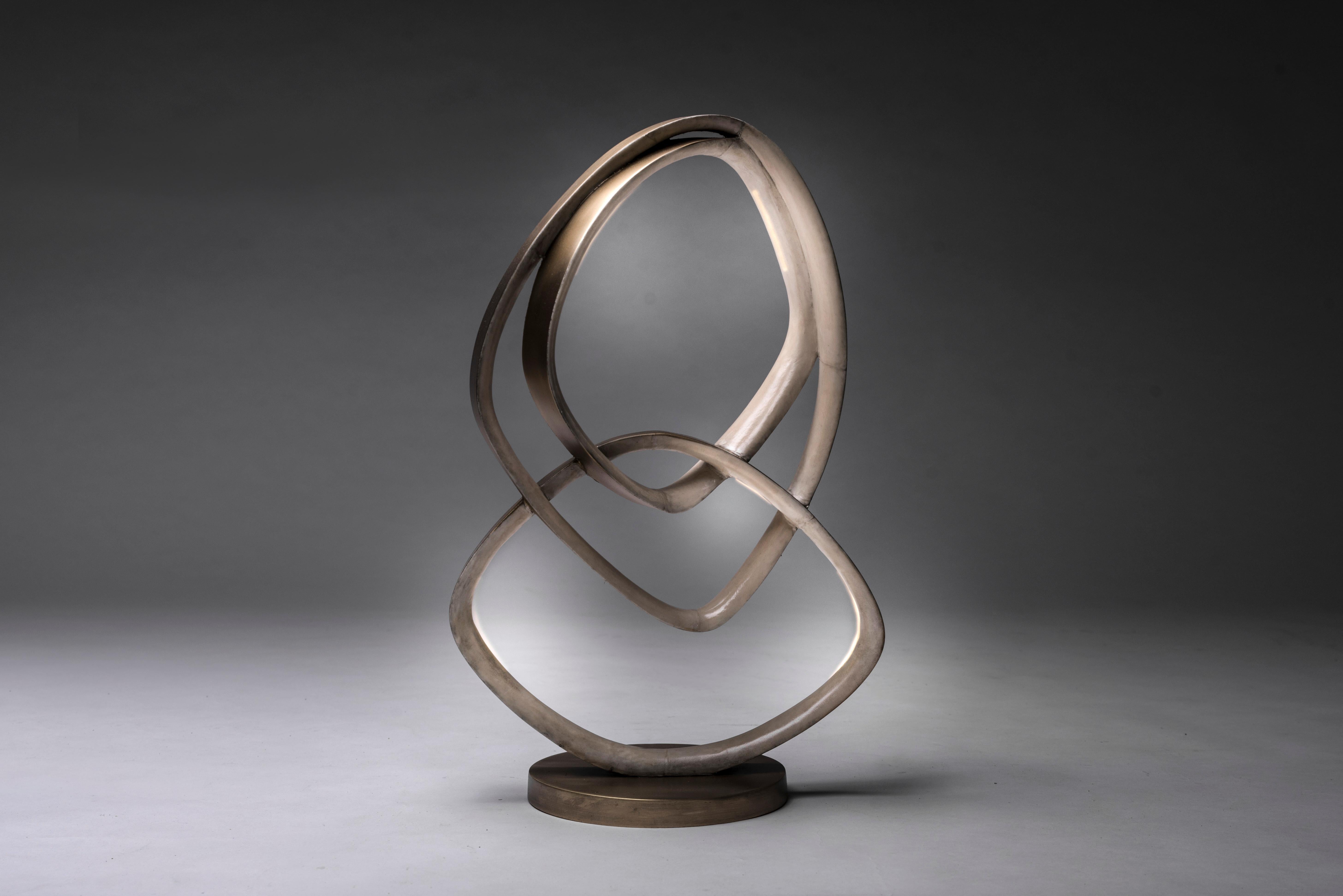 Patrick Coard Paris launches a unique and beautifully sculptural lighting collection inspired by music as a continuation of his candle line. The Teardrop table lamp in parchment and bronze-patina brass is an ethereal and sculptural piece. Each ring