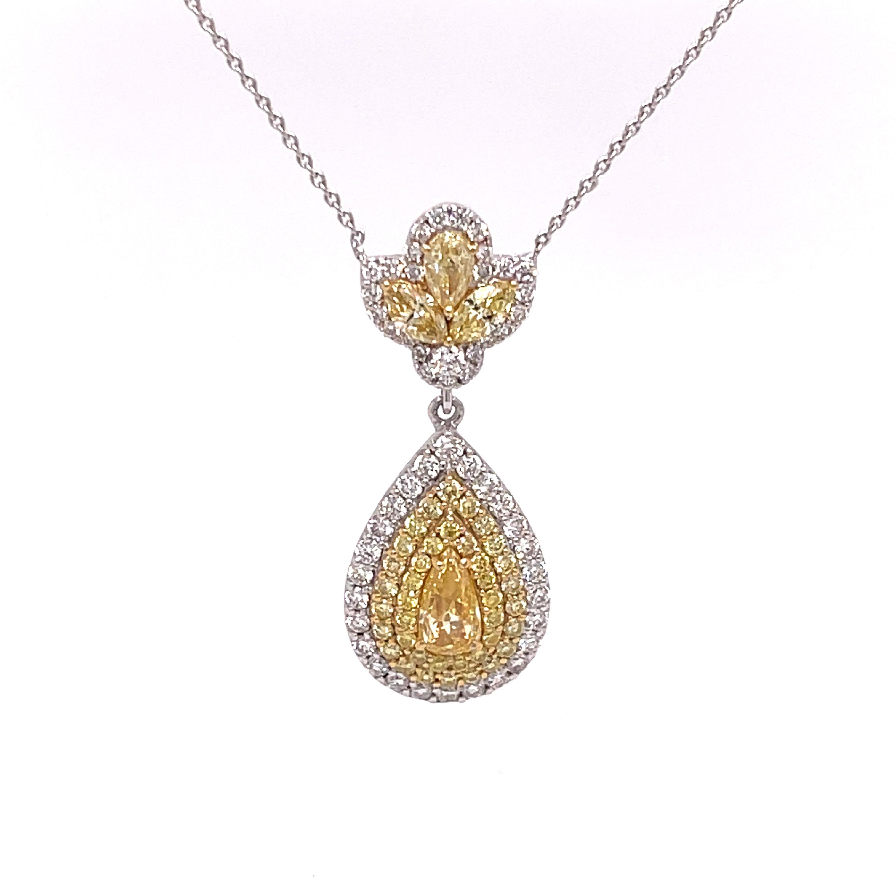 Teardrop diamond pendant necklace in 18K white gold. The pendant features 1.54ctw of yellow pear shape and round diamonds, and 0.46ctw of round white diamonds. The chain can be worn at a 18