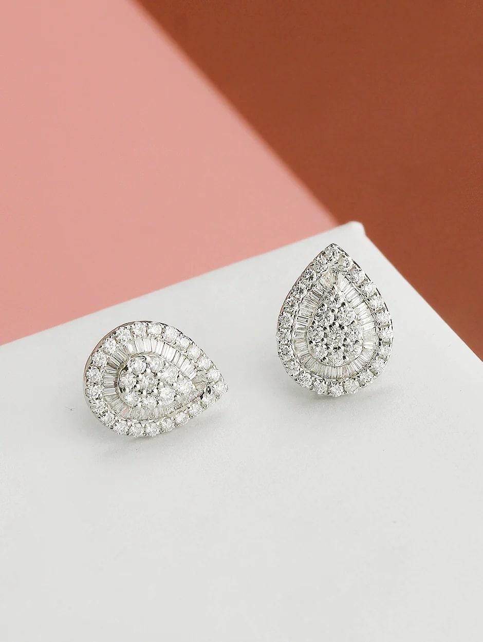 Combination of micro pave and baguette diamond pear shape earring, all with a high polish finish. Available in 18K White Gold.

Earring Information
Diamond Type : Natural Diamond
Metal : 18K
Metal Color : White Gold
Diamond Carat Weight :