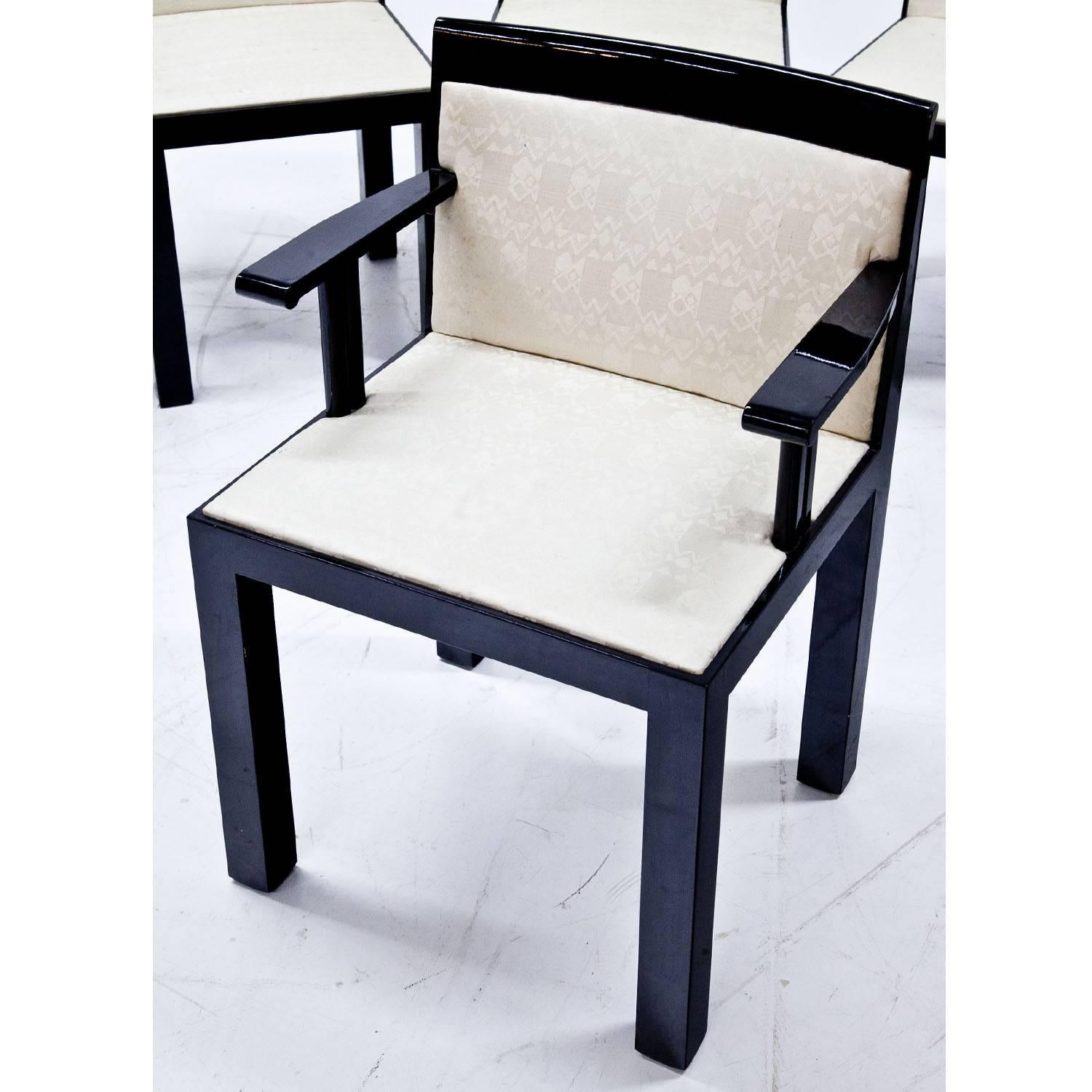 Set of four 'Teatro' chairs and two armchairs by Aldo Rossi with ebonized straight legs and armrests. The beige fabric is original and is in a used condition.