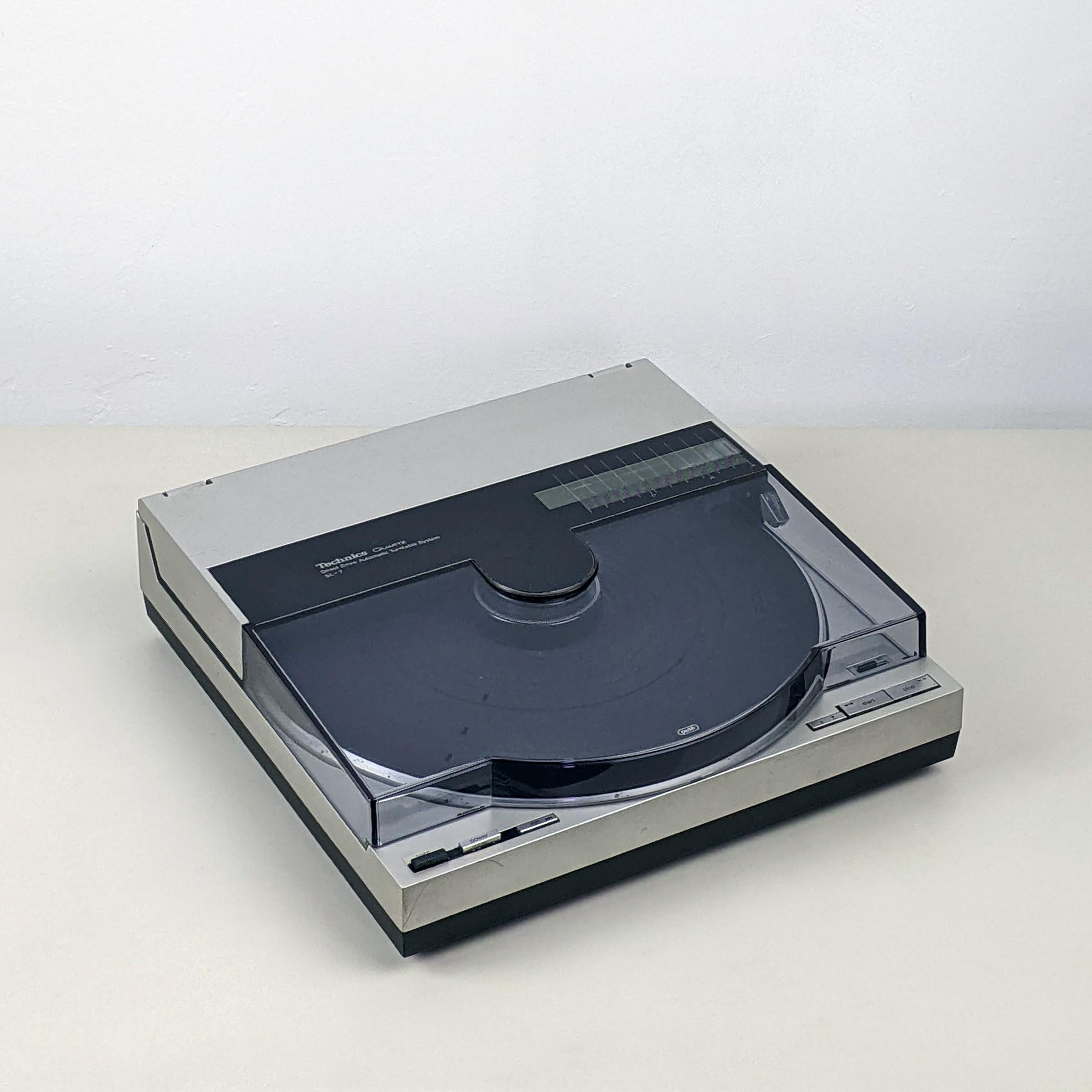 Technics SL-7 XA Turntable, 1981-83
Good condition. Fully functioning. Sounds super.
A great example of this legendary, highly though-of classic turntable.

Cosmetic: The turntable is in good original condition. There are general minor signs of