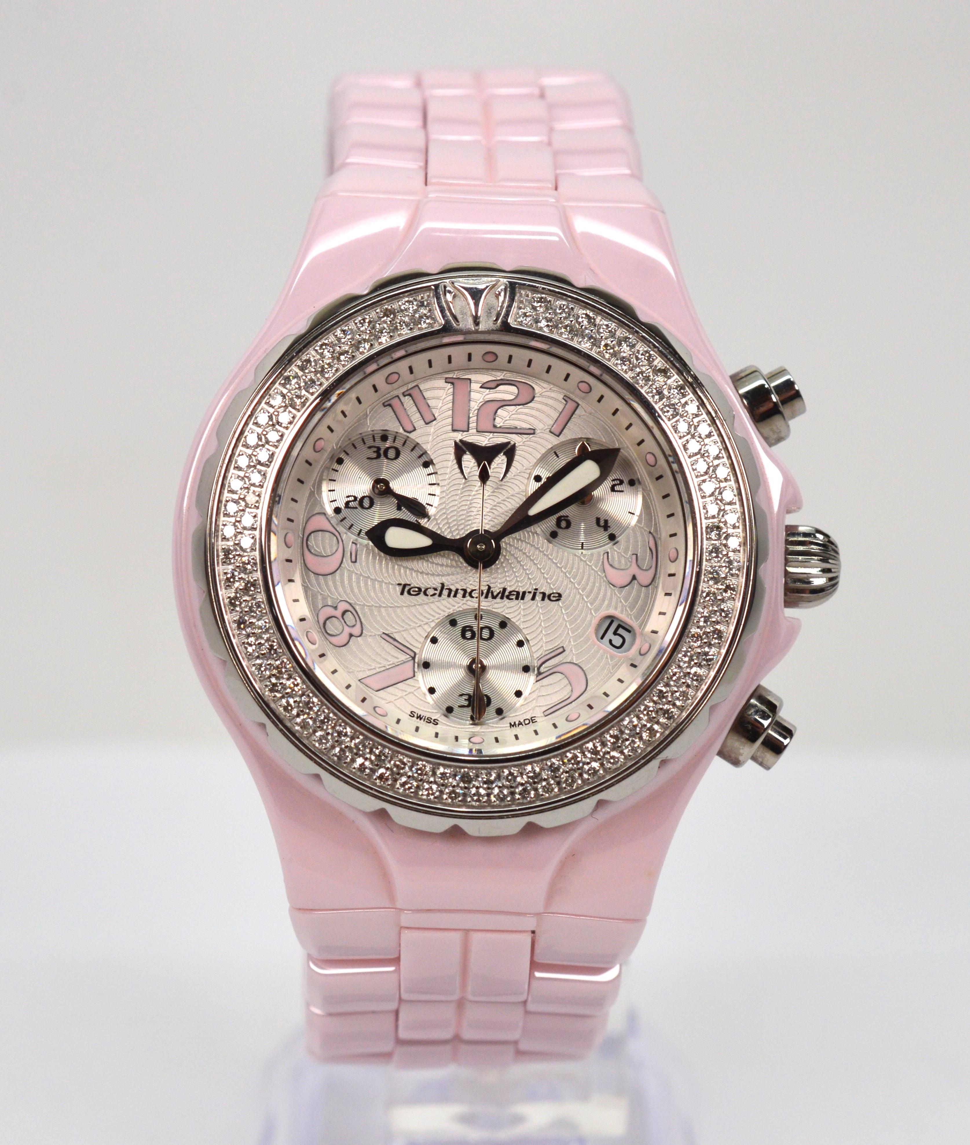 A fresh, bold and exciting timepiece for the ladies by TechnoMarine. The highly polished pink ceramic finish grabs your attention and draws you in to the intricate modern dial framed by a bezel of over 100 white diamonds, .90 ct. TW.  In high