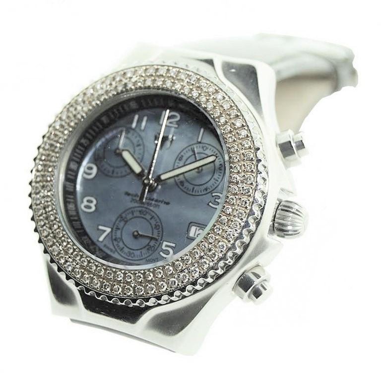 FACTORY / HOUSE: TechnoMarine
STYLE / REFERENCE:  SW / 05611
METAL / MATERIAL: Steel with Diamond Bezel
CIRCA / YEAR: 1990's
DIMENSIONS / SIZE: 42mm X 39mm
MOVEMENT: Quartz Battery 
DIAL / HANDS:
ATTACHMENT / LENGTH: Bracelet/ Regular Length