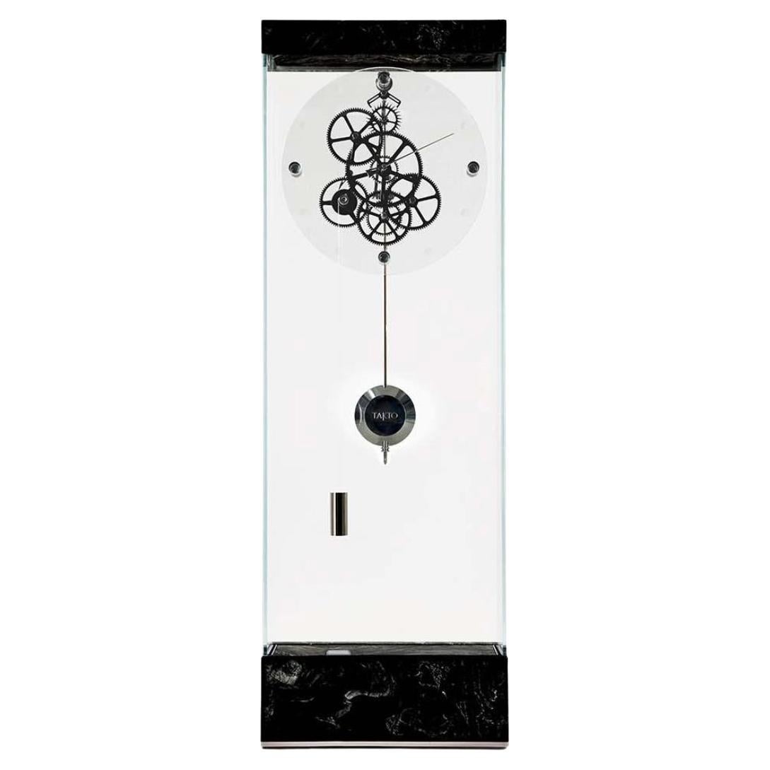 Adagio floor pendulum clock designed by Gianfranco Barban for Teckell is a part of Takto timepieces collection. The clear crystal glass structure of this elegant timepiece allows you to see the beautiful Graham escapement mechanism inside. The