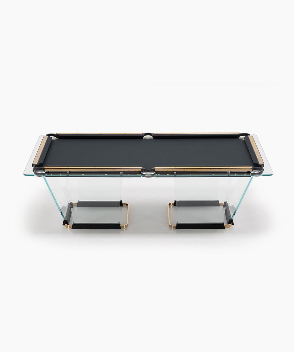 T.1.3  is a billiard-pool table made entirely of glass, where the playing surface is specially treated reproducing the friction of traditional cloth.
The feet are sheets of glass bevelled on both sides that self-stabilize, the support is made of