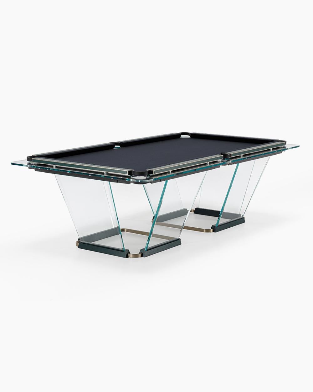 T.1.3  is a billiard-pool table made entirely of glass, where the playing surface is specially treated reproducing the friction of traditional cloth.
The feet are sheets of glass bevelled on both sides that self-stabilize, the support is made of