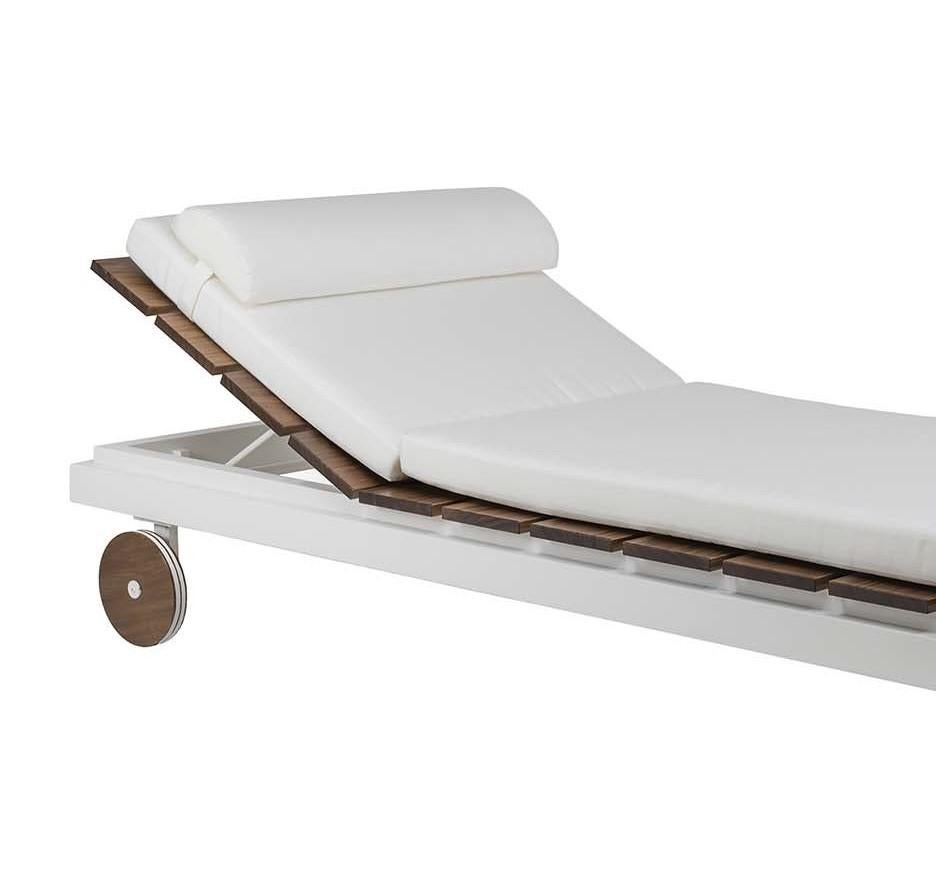 Combining traditional and new materials, functionality and design, this outdoor chaise longue will be an instant favorite at poolside or on a sundeck. The sophisticated silhouette comprises two back wheels and seat slats in solid wood with a